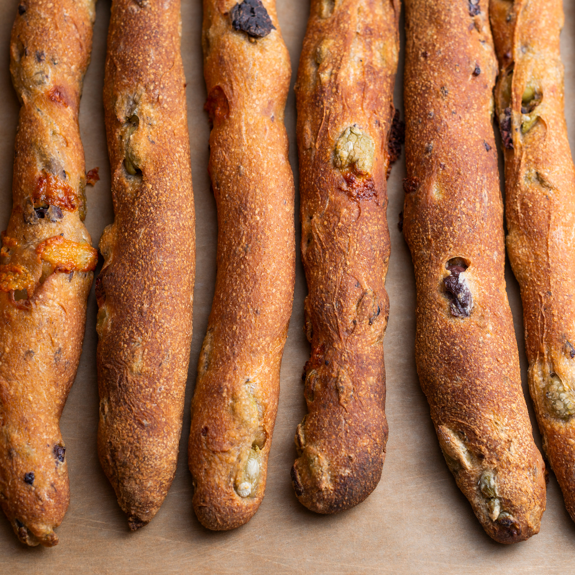 Order Olive & Cheese Breadstick food online from Breads Bakery store, New York on bringmethat.com