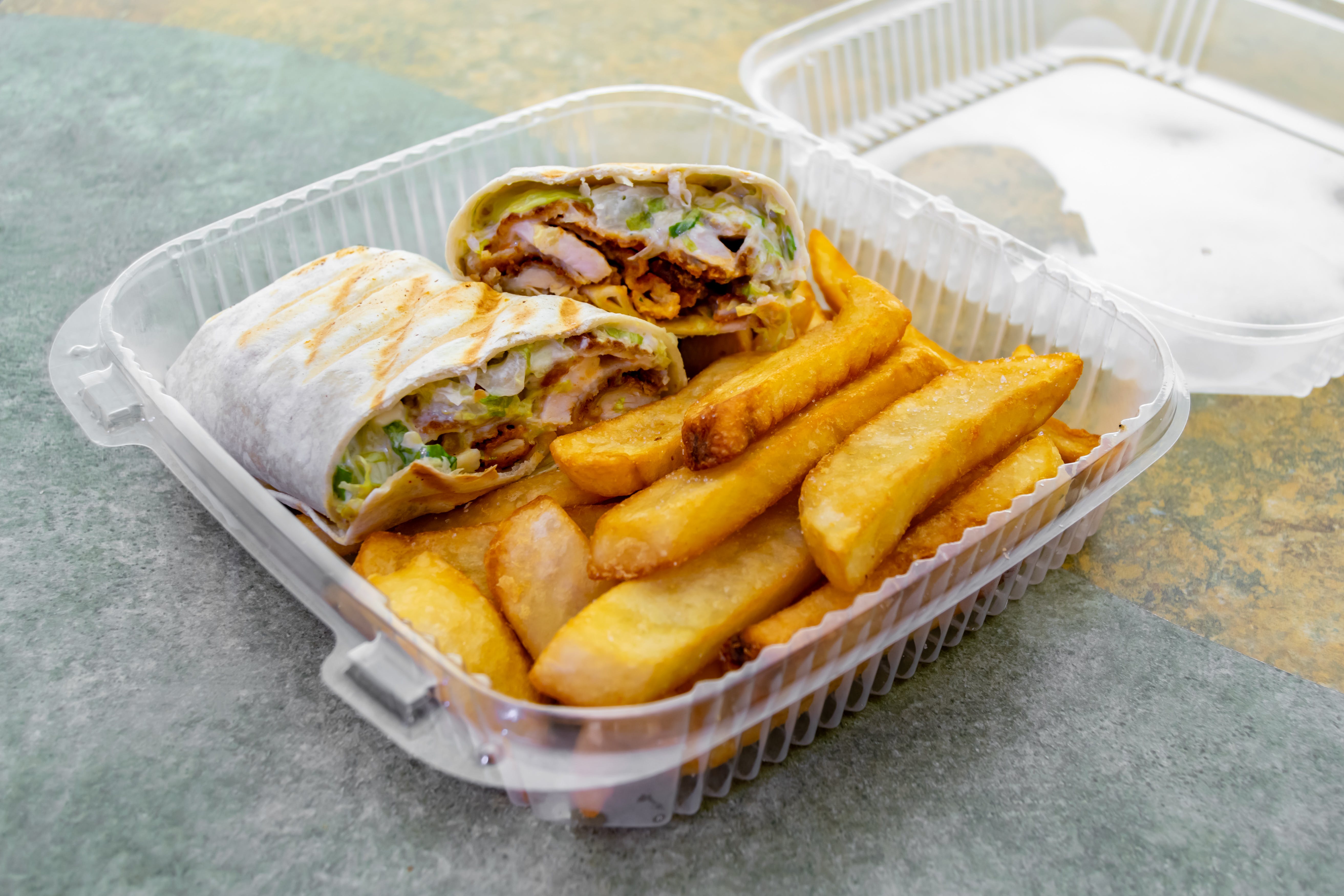 Order Chicken Caesar Wrap - Wrap food online from Two Tony's Pizza store, Linden on bringmethat.com