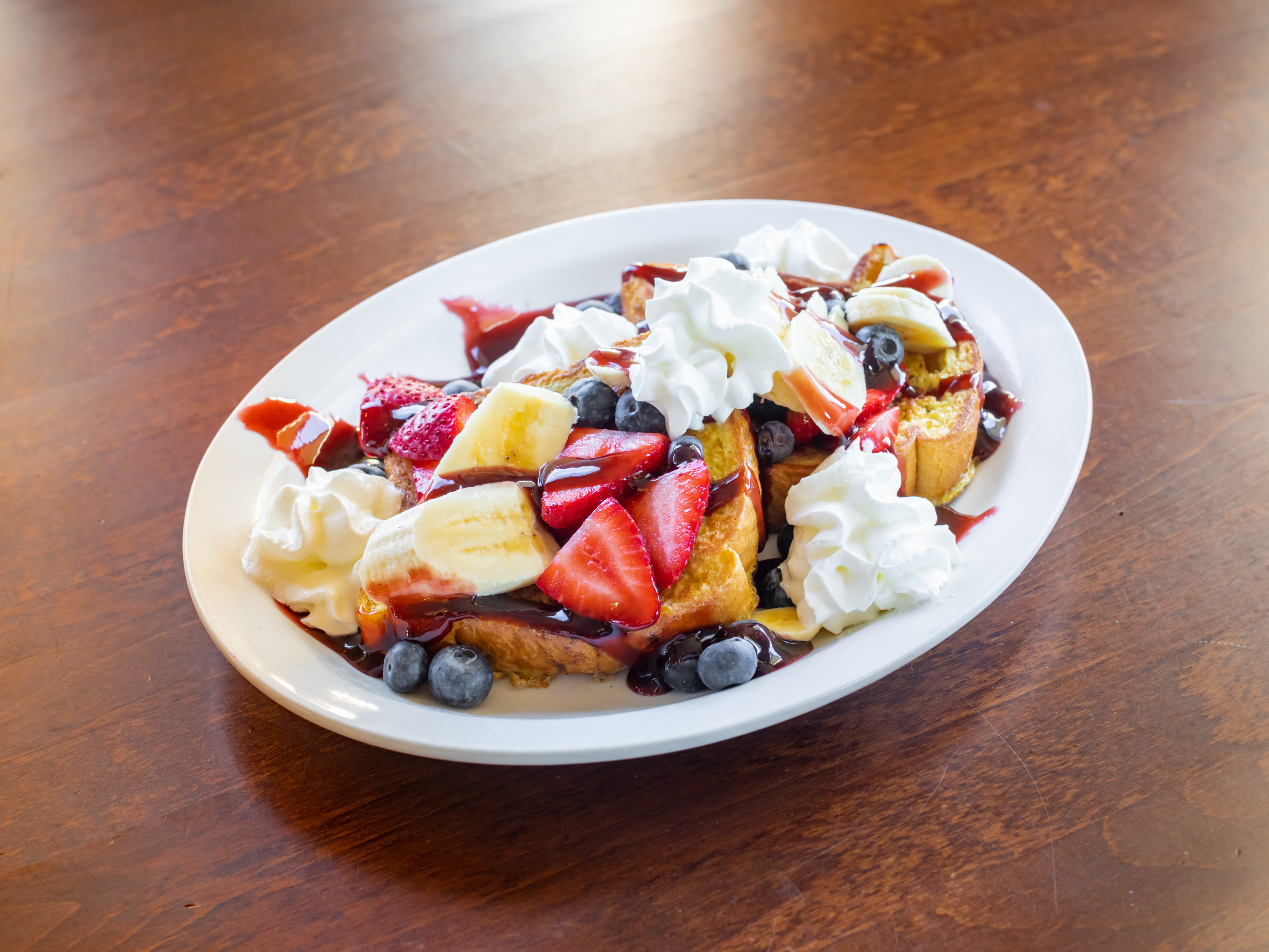Order Banana Berry French Toast food online from Moms Restaurant store, Trenton on bringmethat.com