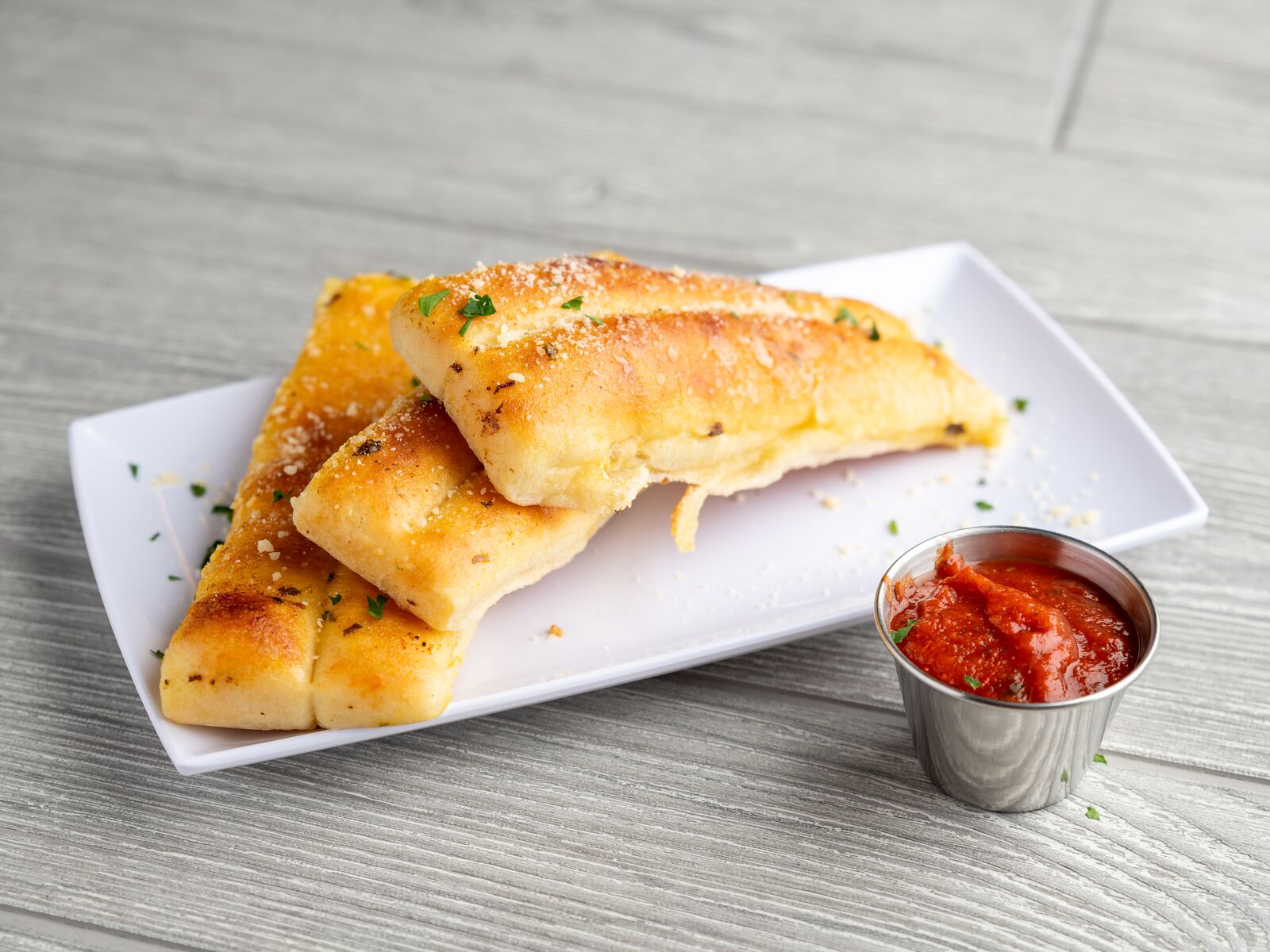 Order Our Famous Italian Breadsticks food online from Rocky Rococo store, Madison on bringmethat.com