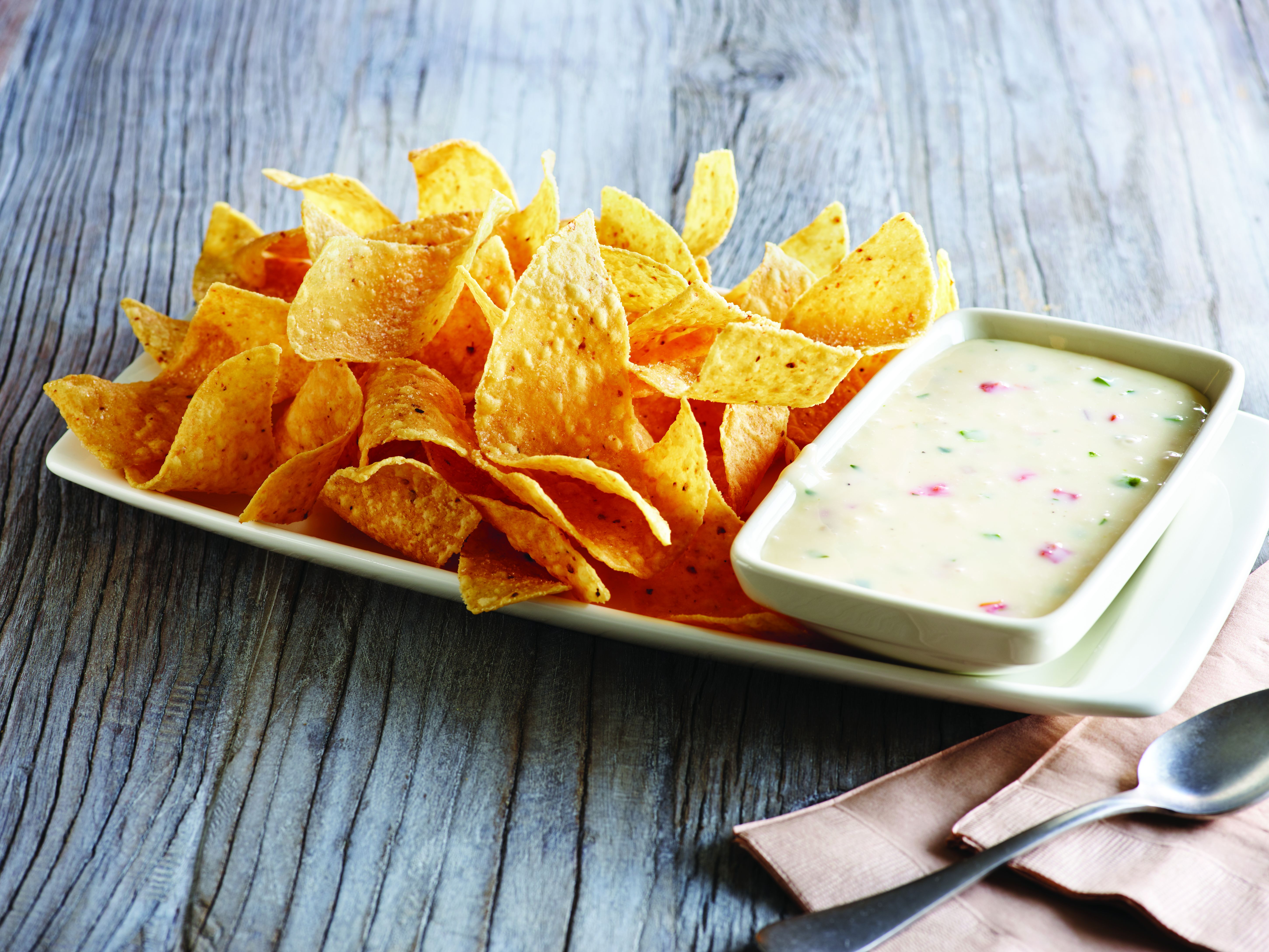 Order White Queso Dip & Chips food online from Applebee store, Quakertown on bringmethat.com