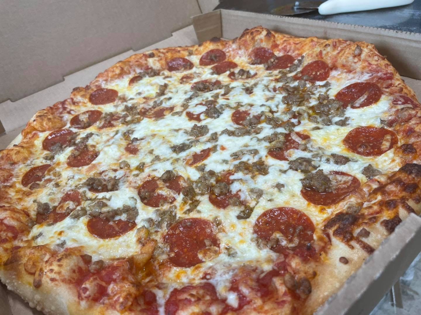 Order Carnivore Pizza - Medium 14" food online from Paesano Pizza & Subs store, Elmira on bringmethat.com
