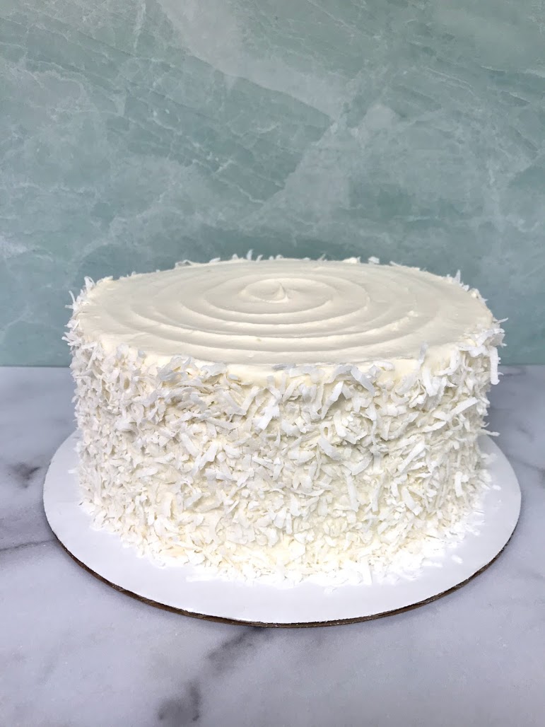 Order Coconut Cake (1 slice) food online from Baby Cakes Confectionary store, Savannah on bringmethat.com