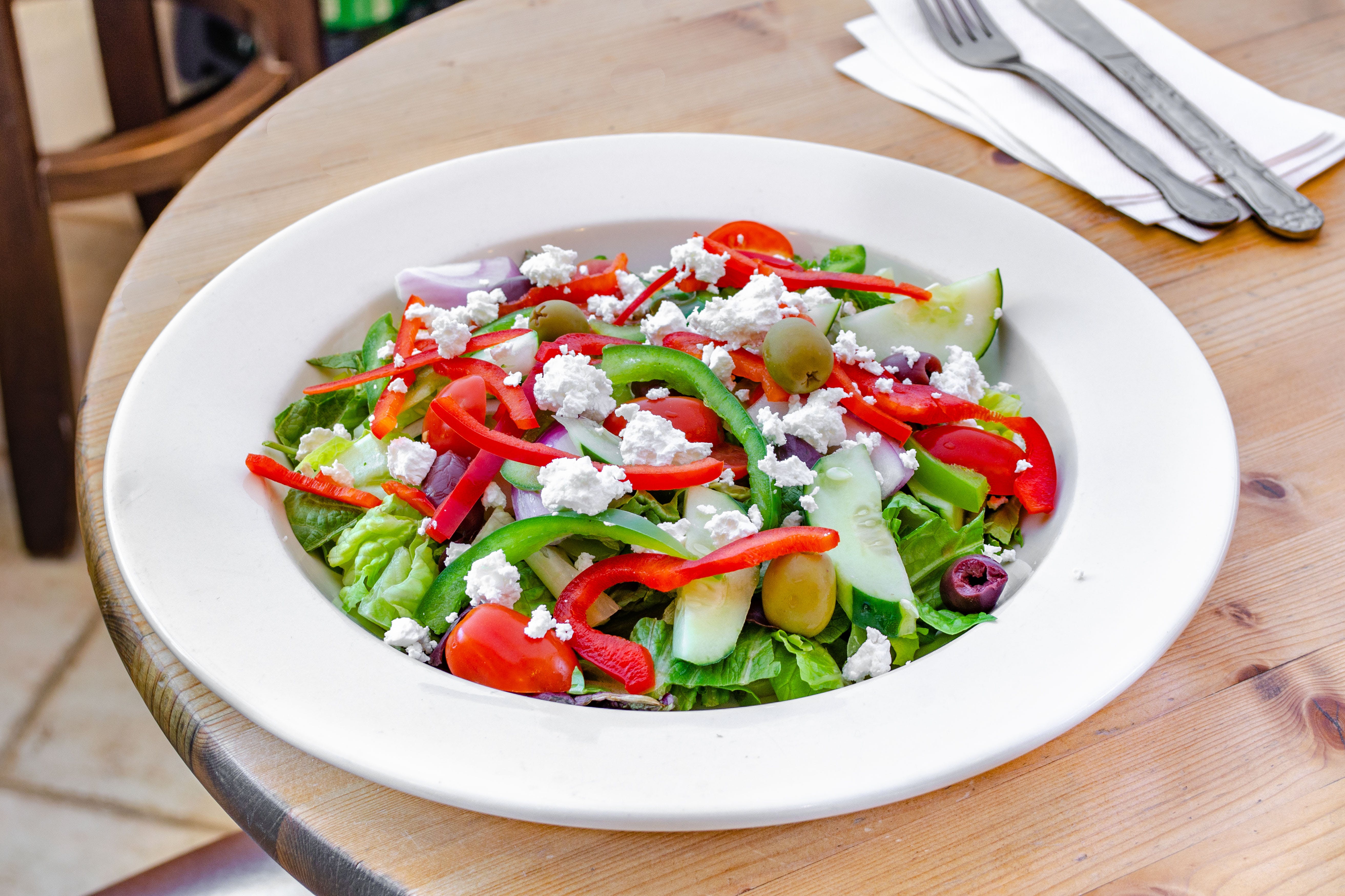 Order Greek Salad - Salad food online from Pizza Station store, Katonah on bringmethat.com