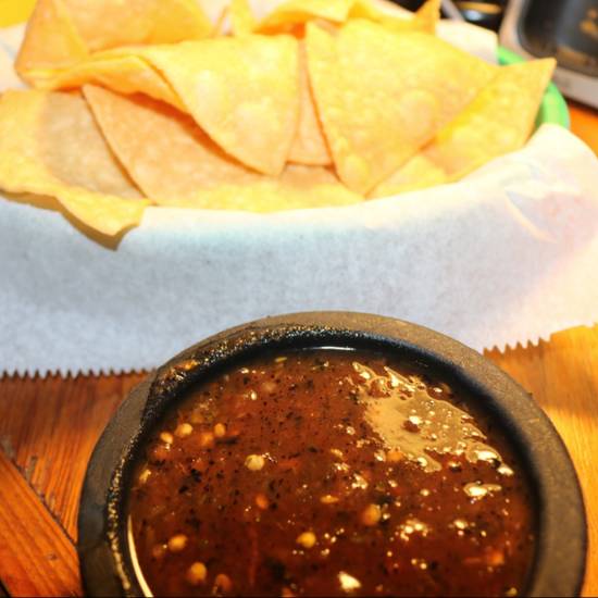 Order Homemade Chips  with small roasted salsa food online from La Mansion Restaurant store, New Orleans on bringmethat.com