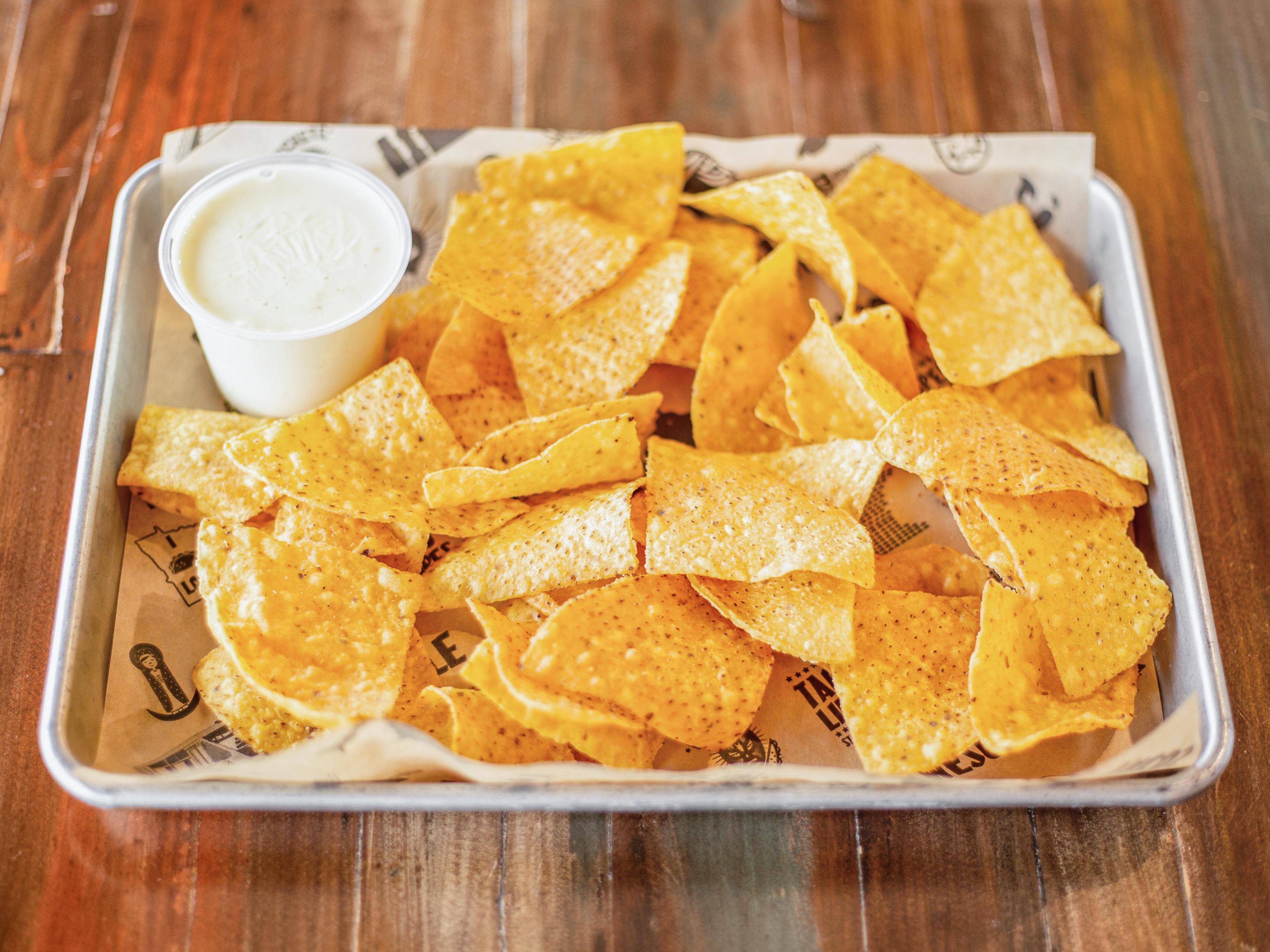 Order Chips and Queso food online from Taco Libre store, Edina on bringmethat.com