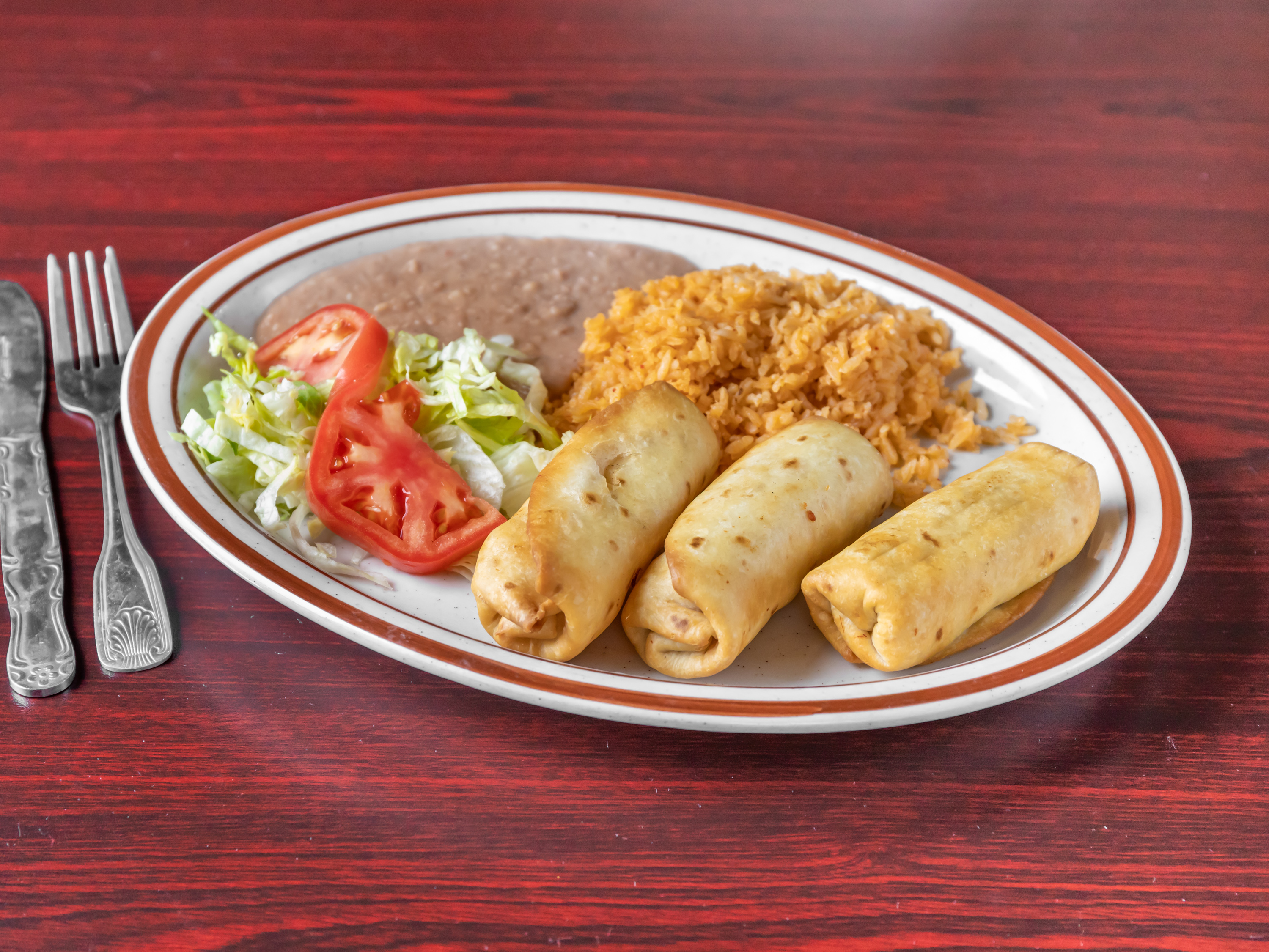 Order Chimichangas 3 food online from 3 Hermanos Restaurant store, Milwaukee on bringmethat.com
