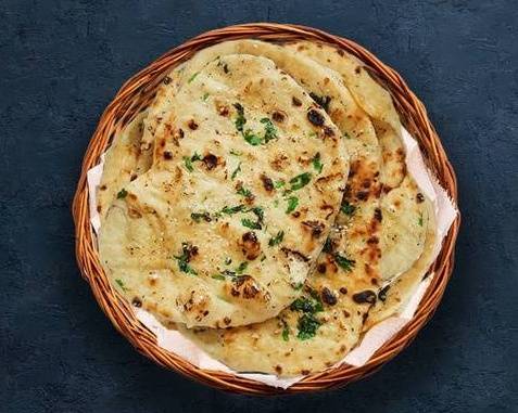 Order Garlic Naan Fiesta food online from Curry Palace store, Buffalo on bringmethat.com
