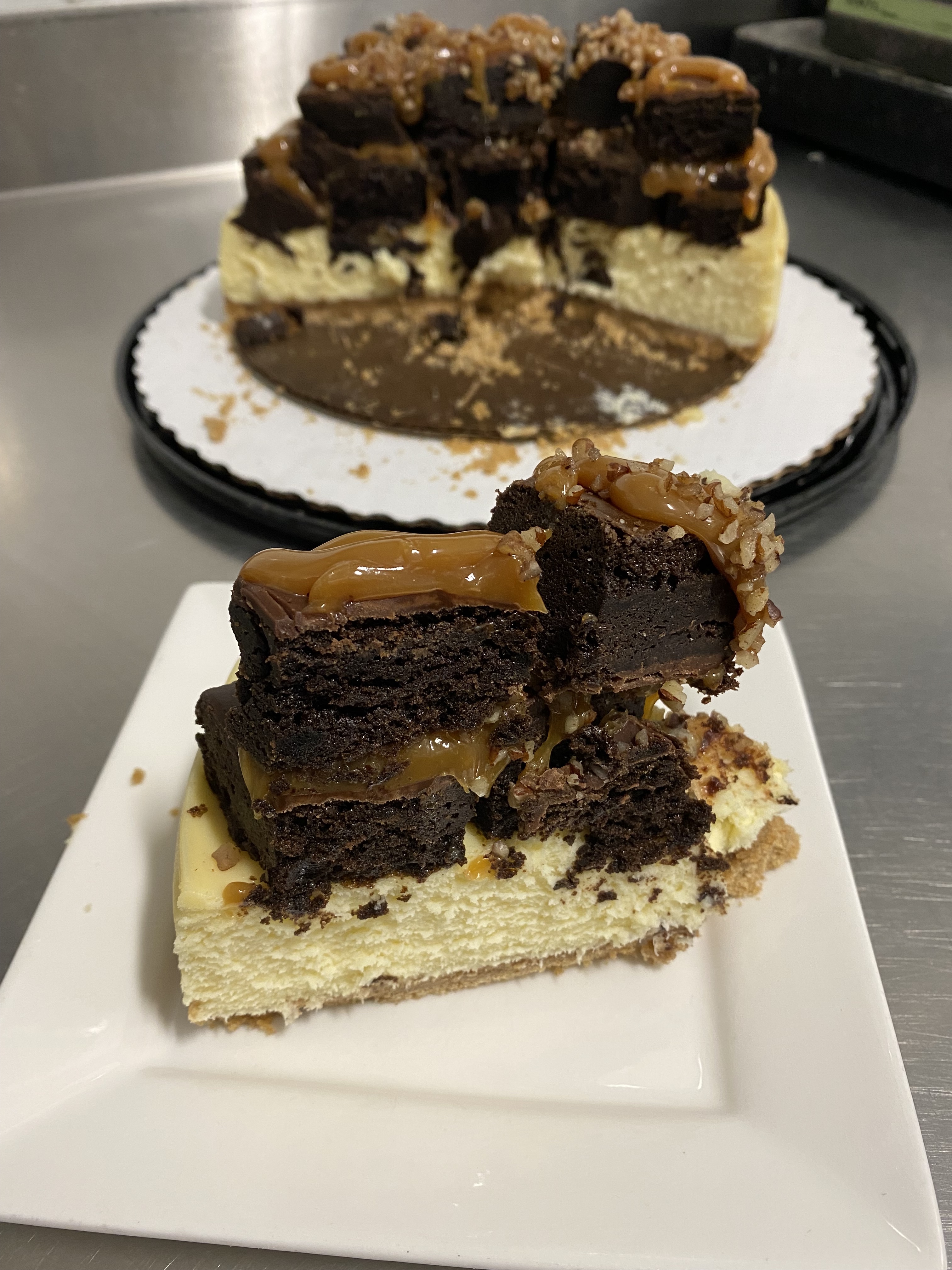 Order NY Cheesecake Topped With Brownie Bites and caramel drizzle food online from Ms Sweets Decadent Dessert store, Ventura on bringmethat.com