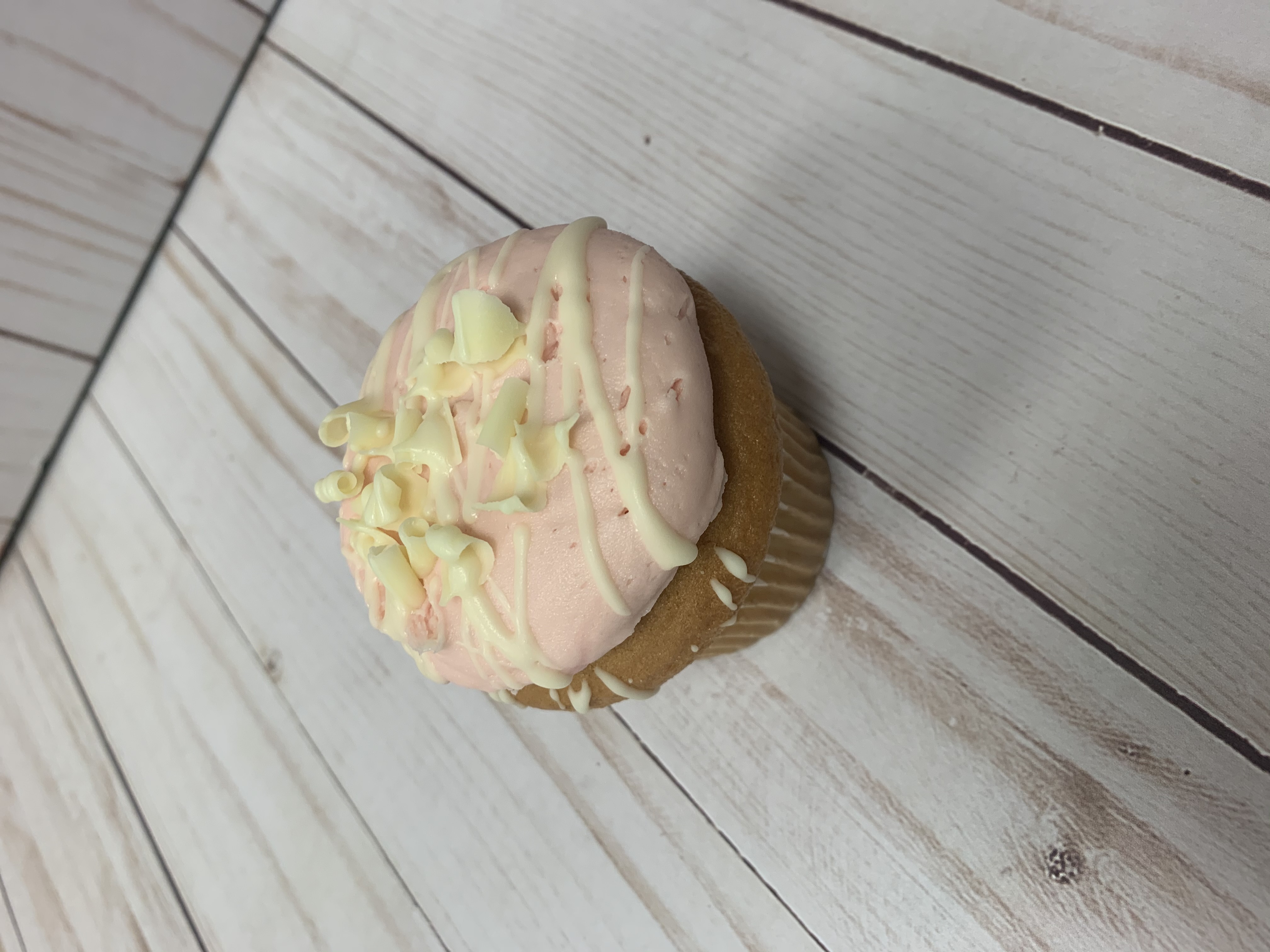 Order White Chocolate Raspberry Cupcake food online from Sweet Spot Bakery store, Melrose on bringmethat.com