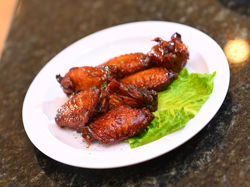 Order 8 Pcs Jerk Wings food online from Cafe 214 store, Addison on bringmethat.com