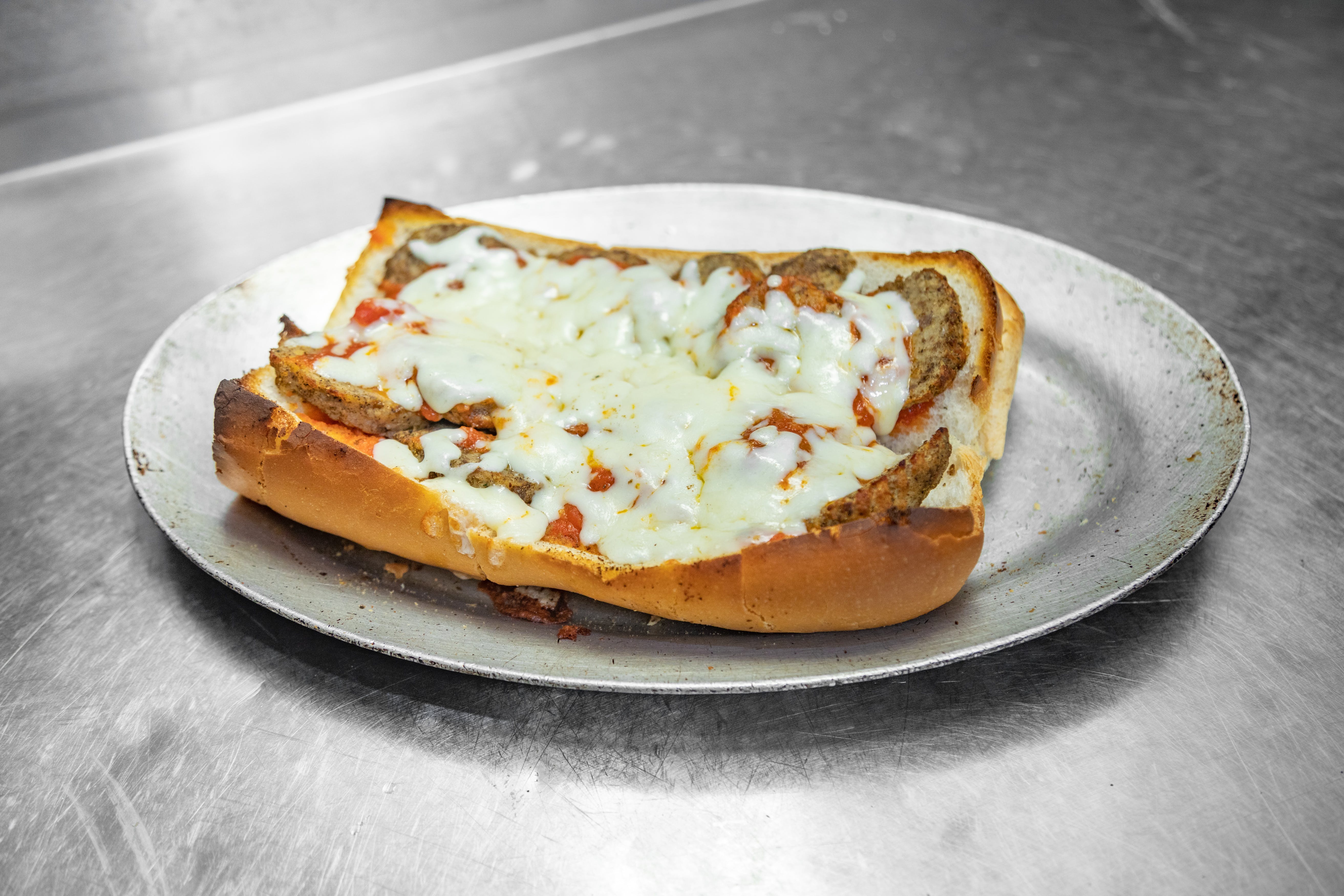 Order Meatball Grinder - Half food online from Campus Pizza store, Hartford on bringmethat.com