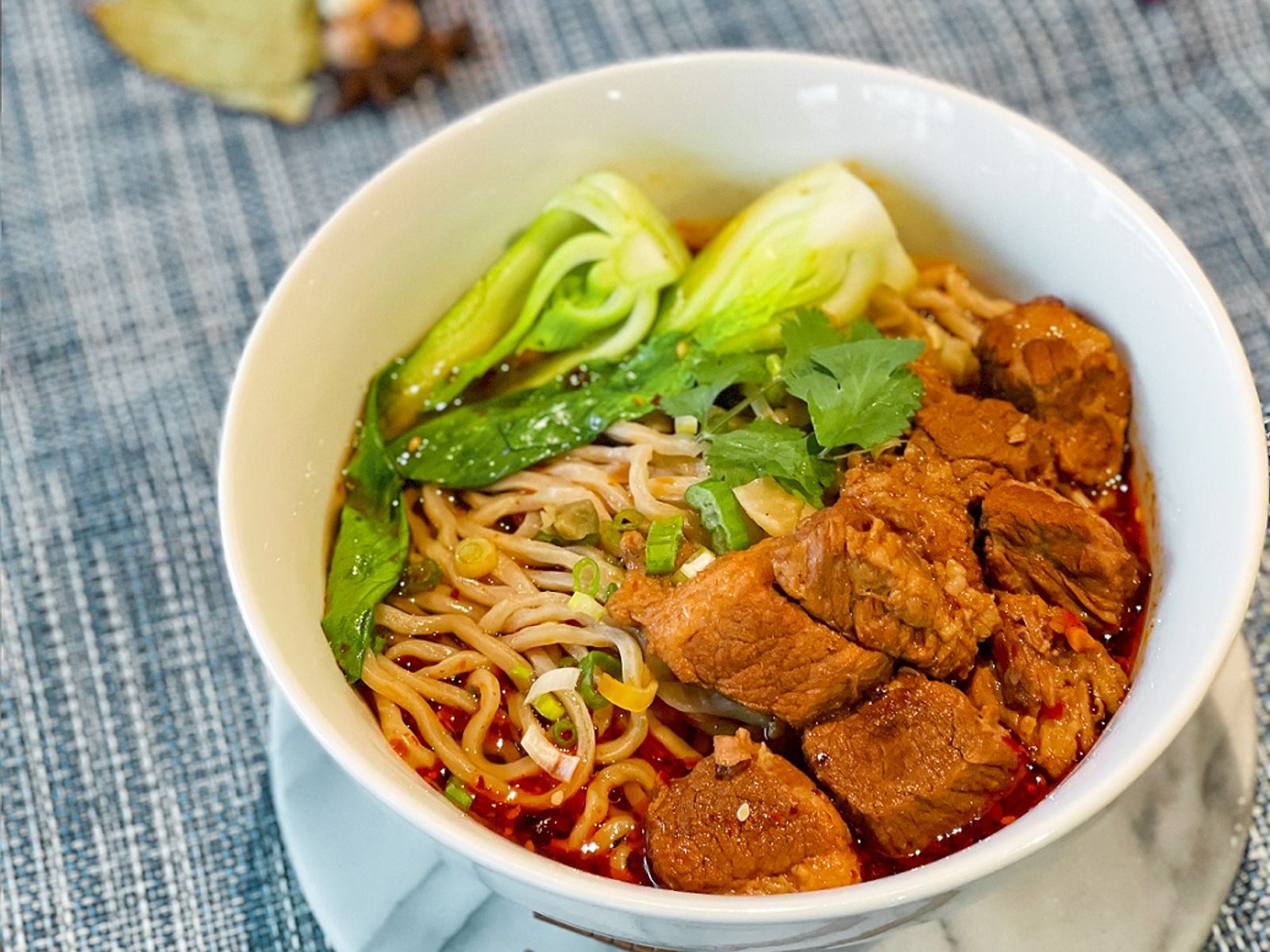 Order A7 Szechuan Style Beef Noodle A7 川味牛肉面 food online from Mid Summer Lounge store, Champaign on bringmethat.com
