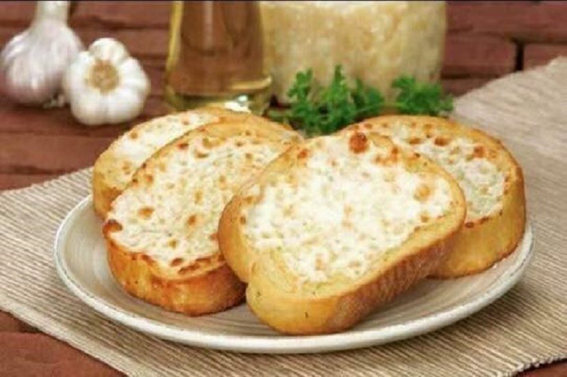 Order Garlic Bread with Cheese - 4 Pieces food online from Pizza Garden store, Manitowoc on bringmethat.com