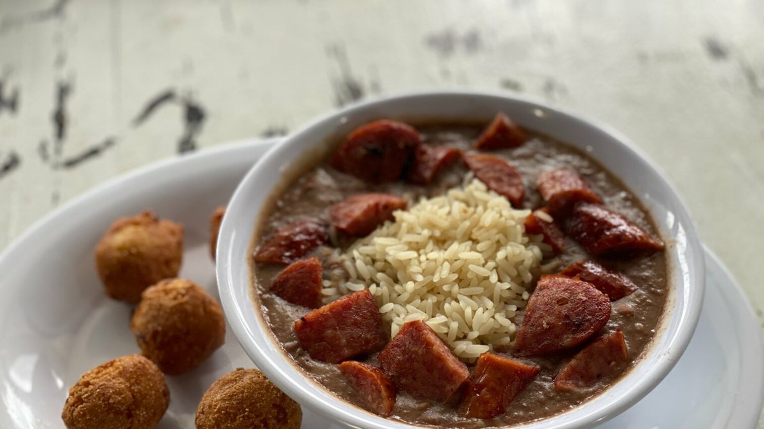 Order Cajun Sausage with Red Beans and Rice food online from The Station Seafood Co. store, Houston on bringmethat.com