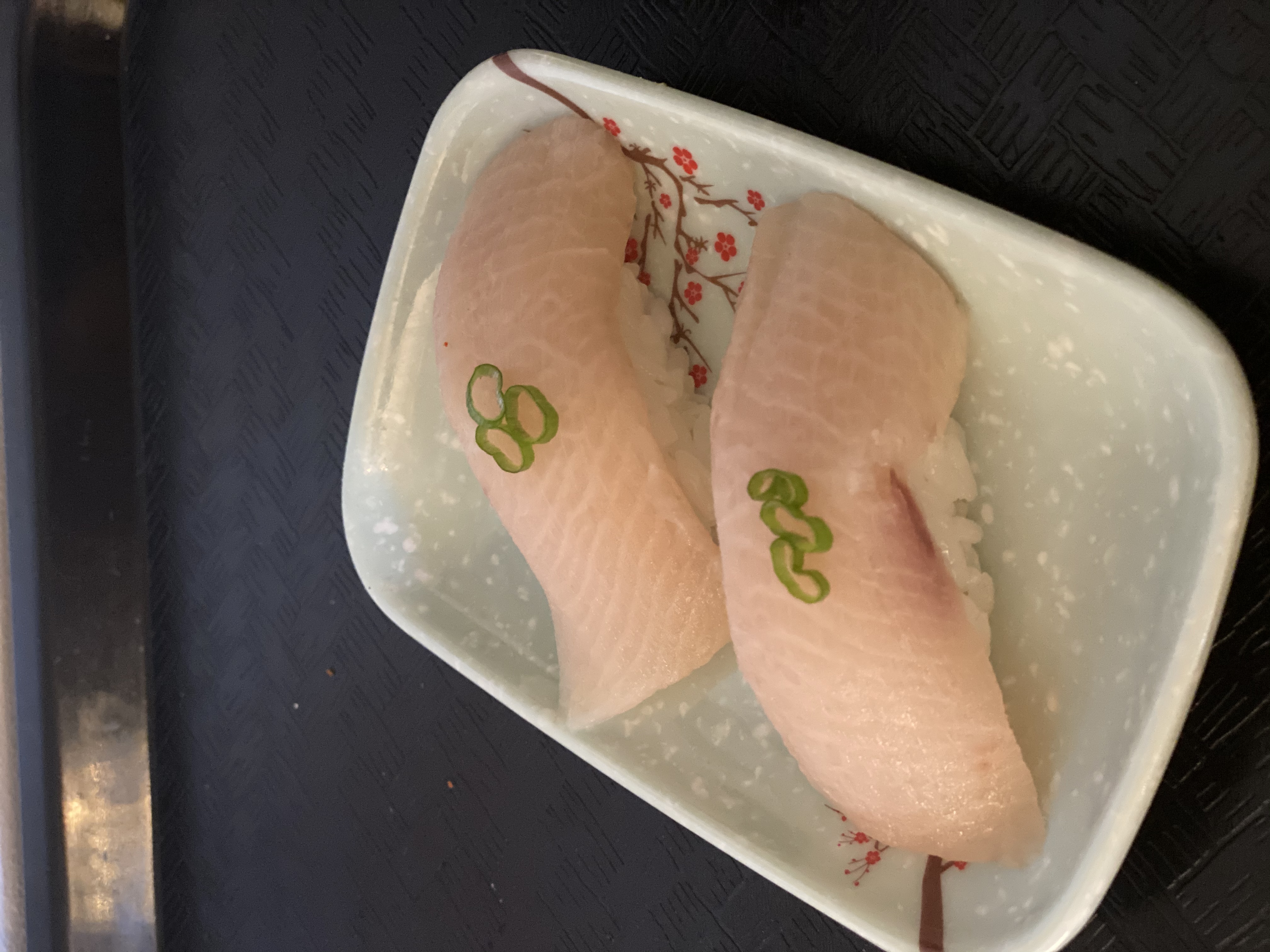 Order 51. Hamachi Nigiri 黄尾鱼贴面 food online from Tengu Sushi store, Newport on bringmethat.com
