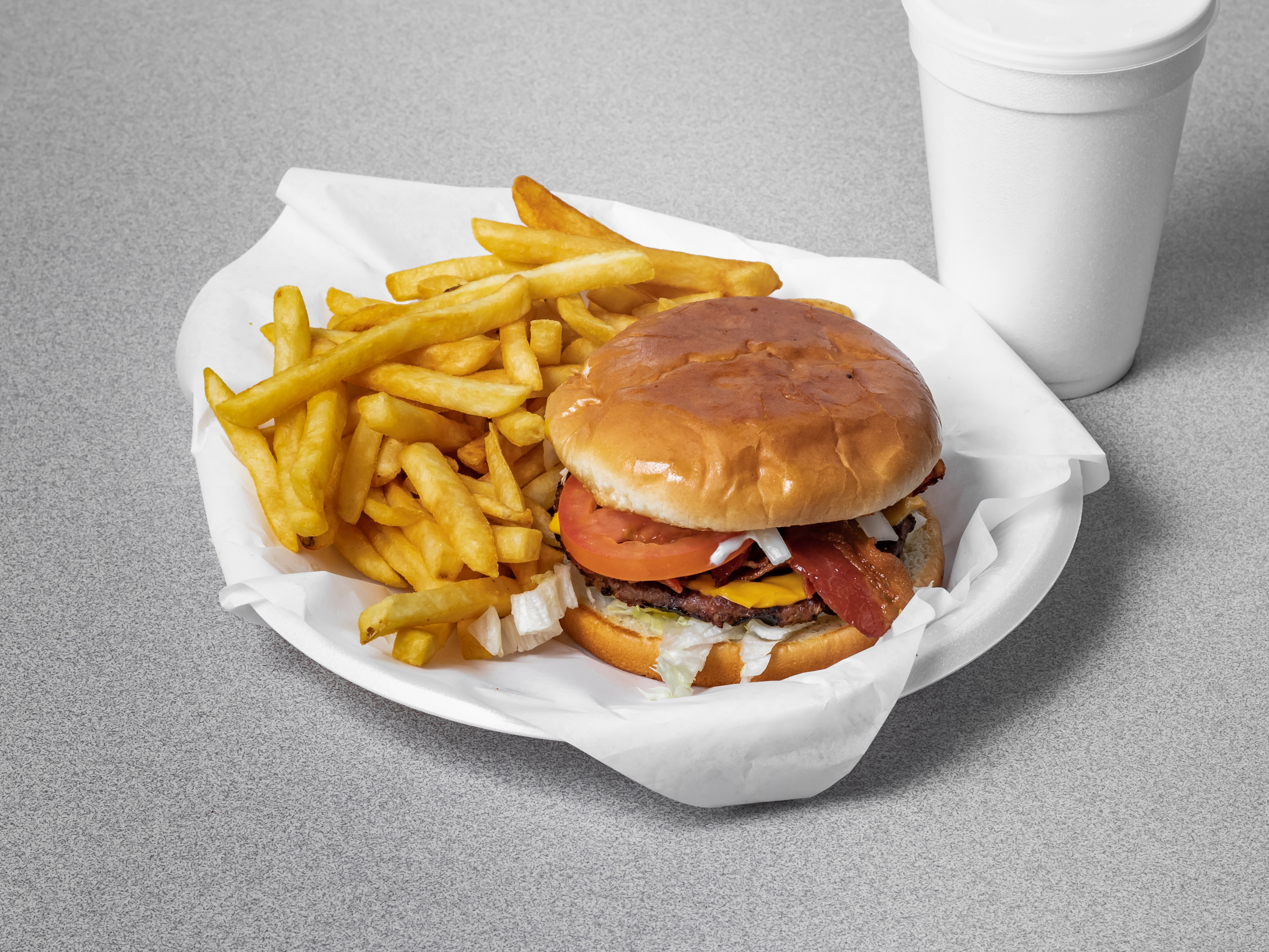 Order 1/4 lb. Burger and Fries food online from Paul Donuts Subs & Gyros store, Fort Worth on bringmethat.com