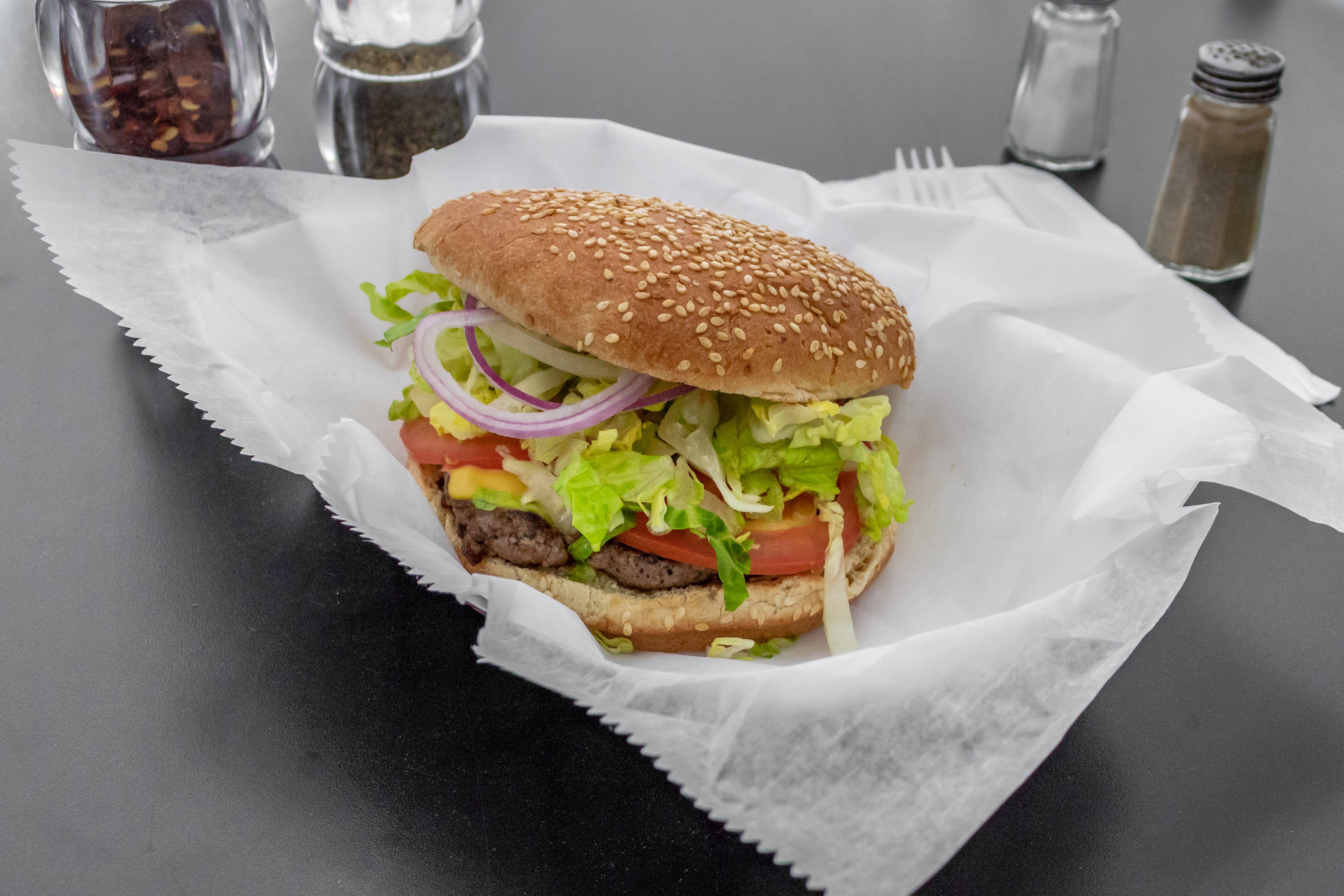 Order Cheeseburger - Burger food online from Douglass Pizza & Grill store, Franklin Park on bringmethat.com