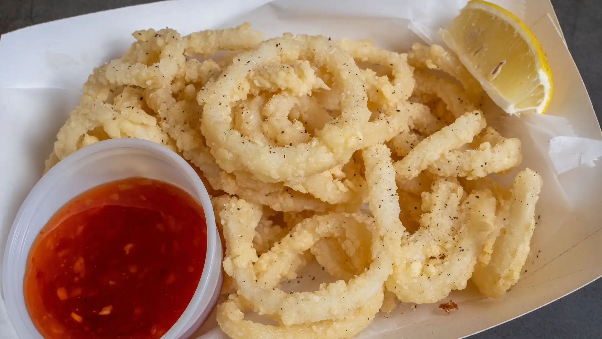 Order Fried Calamari food online from New Lucky Crab House store, Oakwood on bringmethat.com