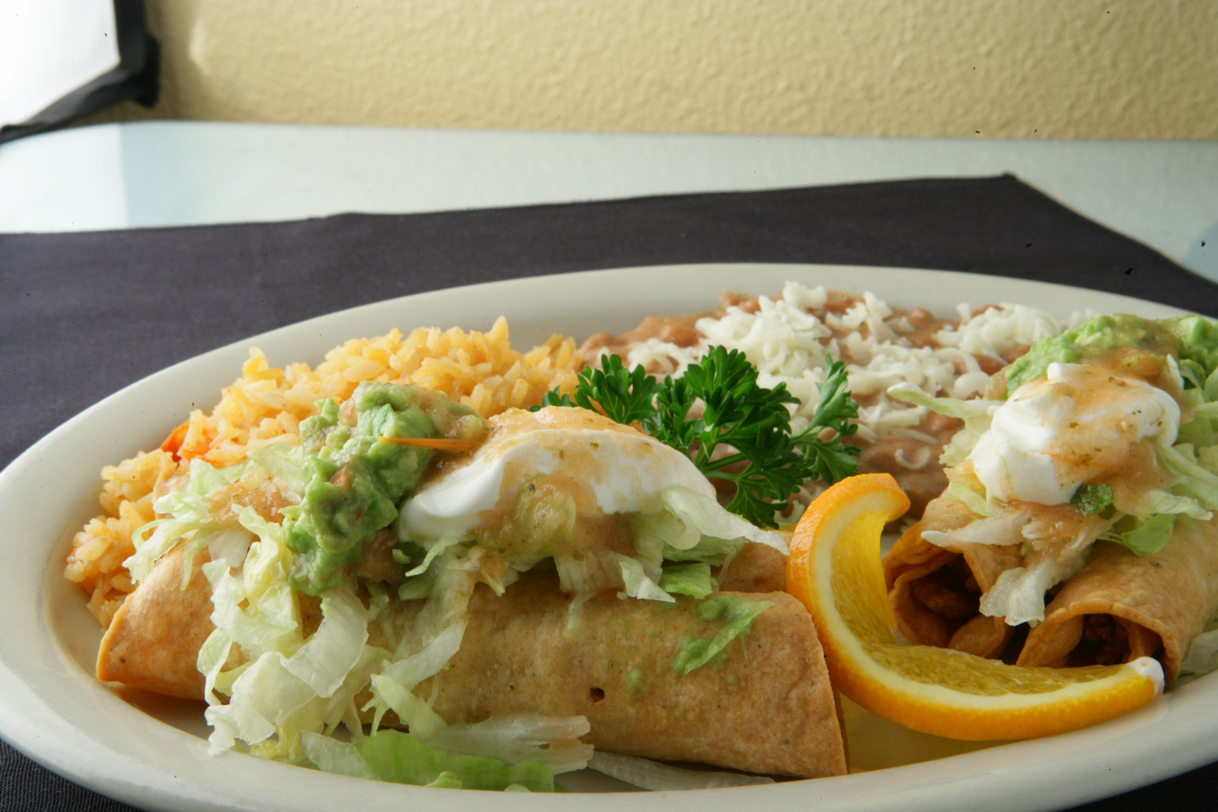 Order 4 Flautas Rice and Beans Combo food online from Chapala Mexican Restaurant store, Brentwood on bringmethat.com