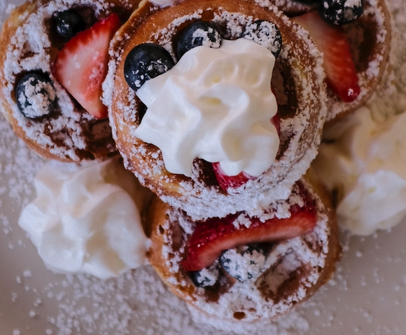 Order 4 Mini Waffles with Seasonal Berries and Whipped Cream food online from Braxton Kitchen store, Camarillo on bringmethat.com