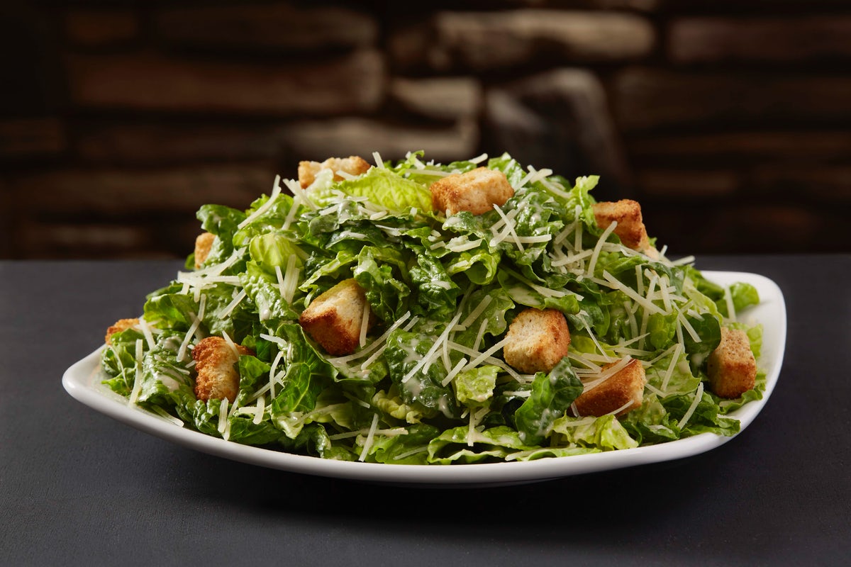 Order Caesar Entrée Salad food online from Sizzler store, Fountain Valley on bringmethat.com