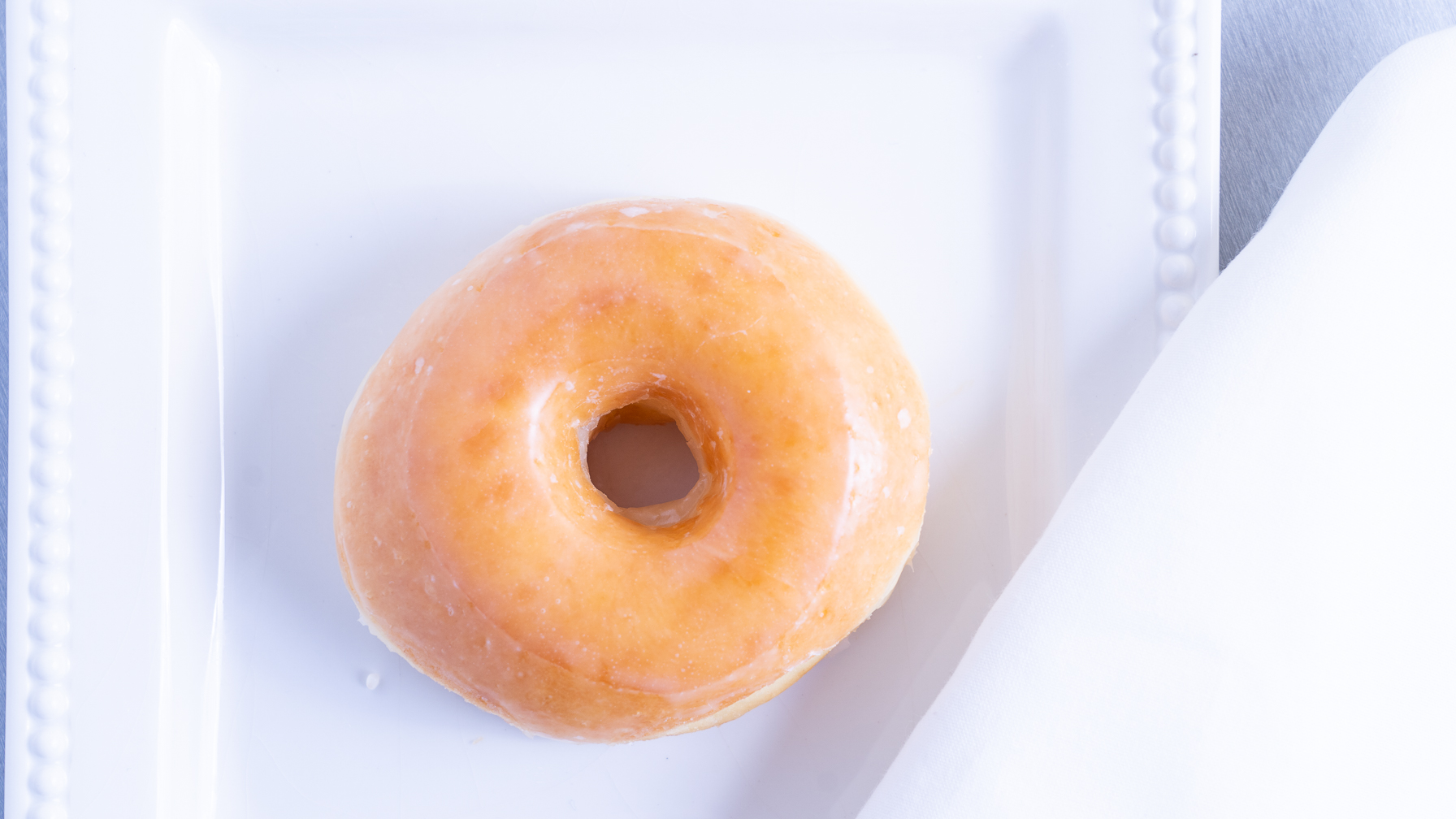 Order Glazed Donut food online from Bakers Dozen Donuts store, Sachse on bringmethat.com