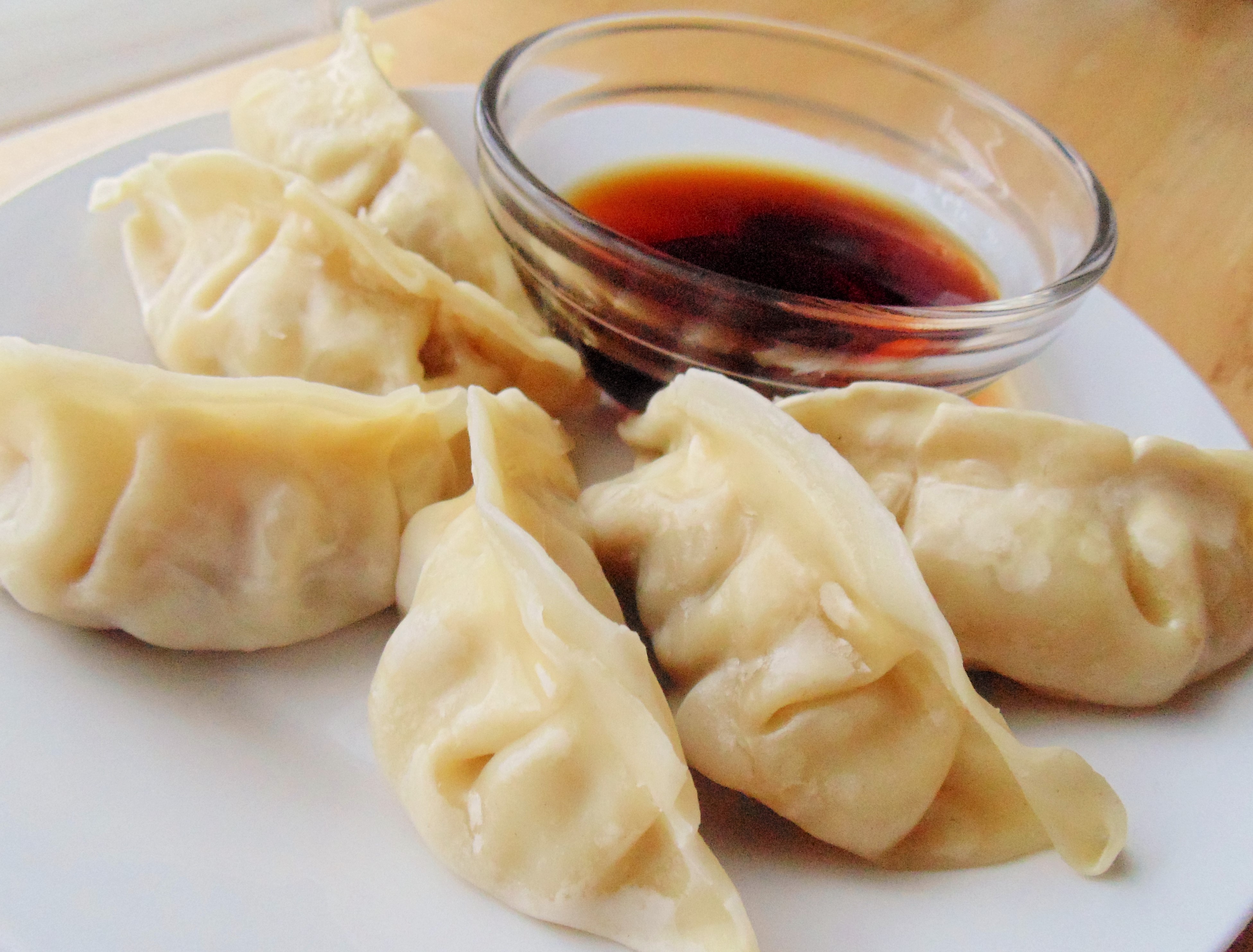 Order Steamed Dumplings food online from New Hing Hing Kitchen store, Mineola on bringmethat.com