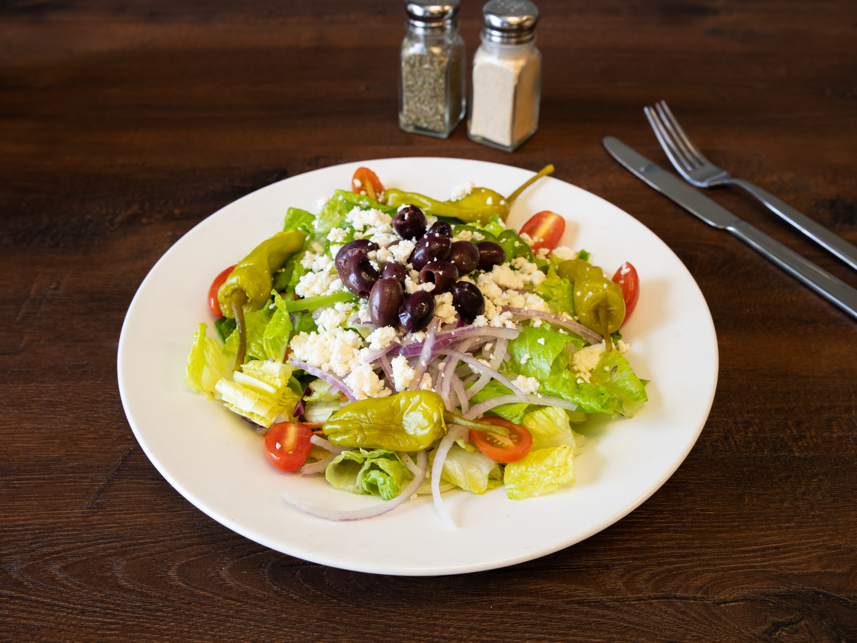 Order Greek Salad food online from Italian Village Pizza store, Orlando on bringmethat.com