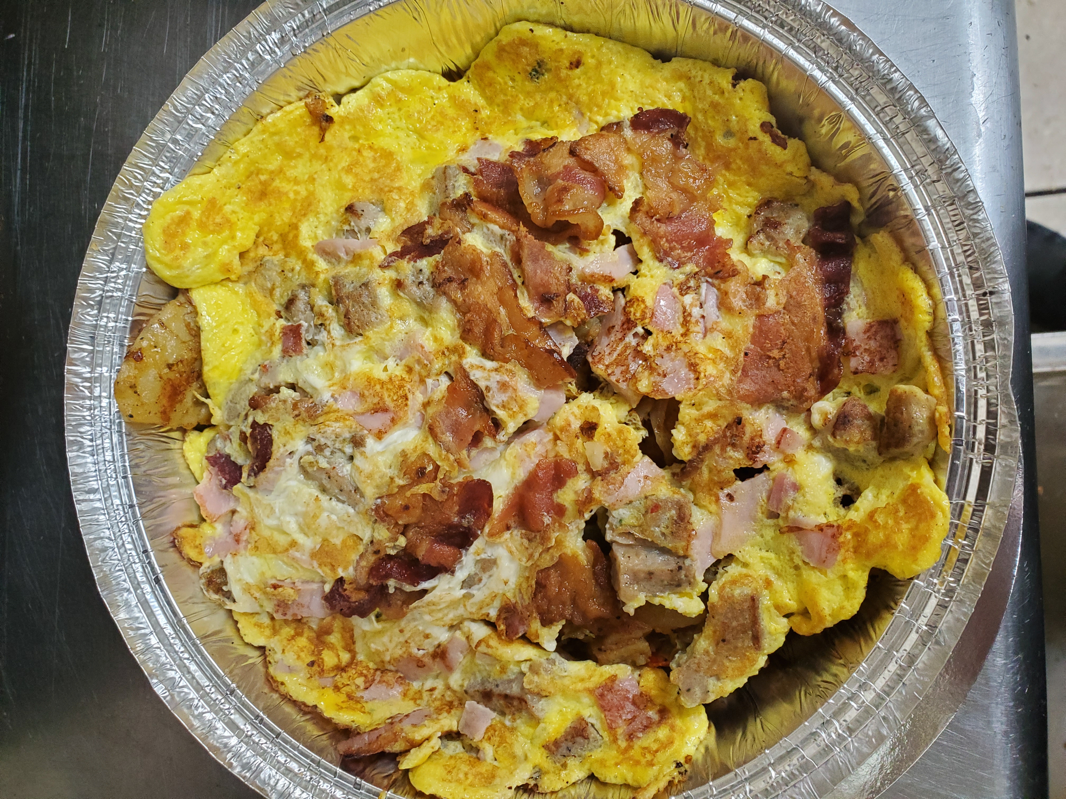 Order Meat Lover Omelette food online from Aminas Cafe store, Bronx on bringmethat.com