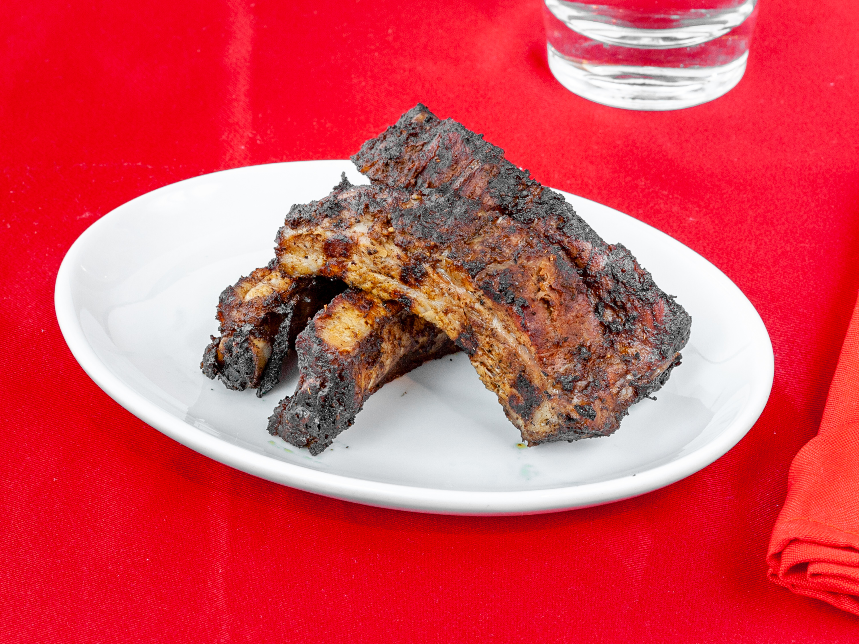 Order Jerk Ribs Appetizer to food online from Ja' Grill Hyde Park store, Chicago on bringmethat.com