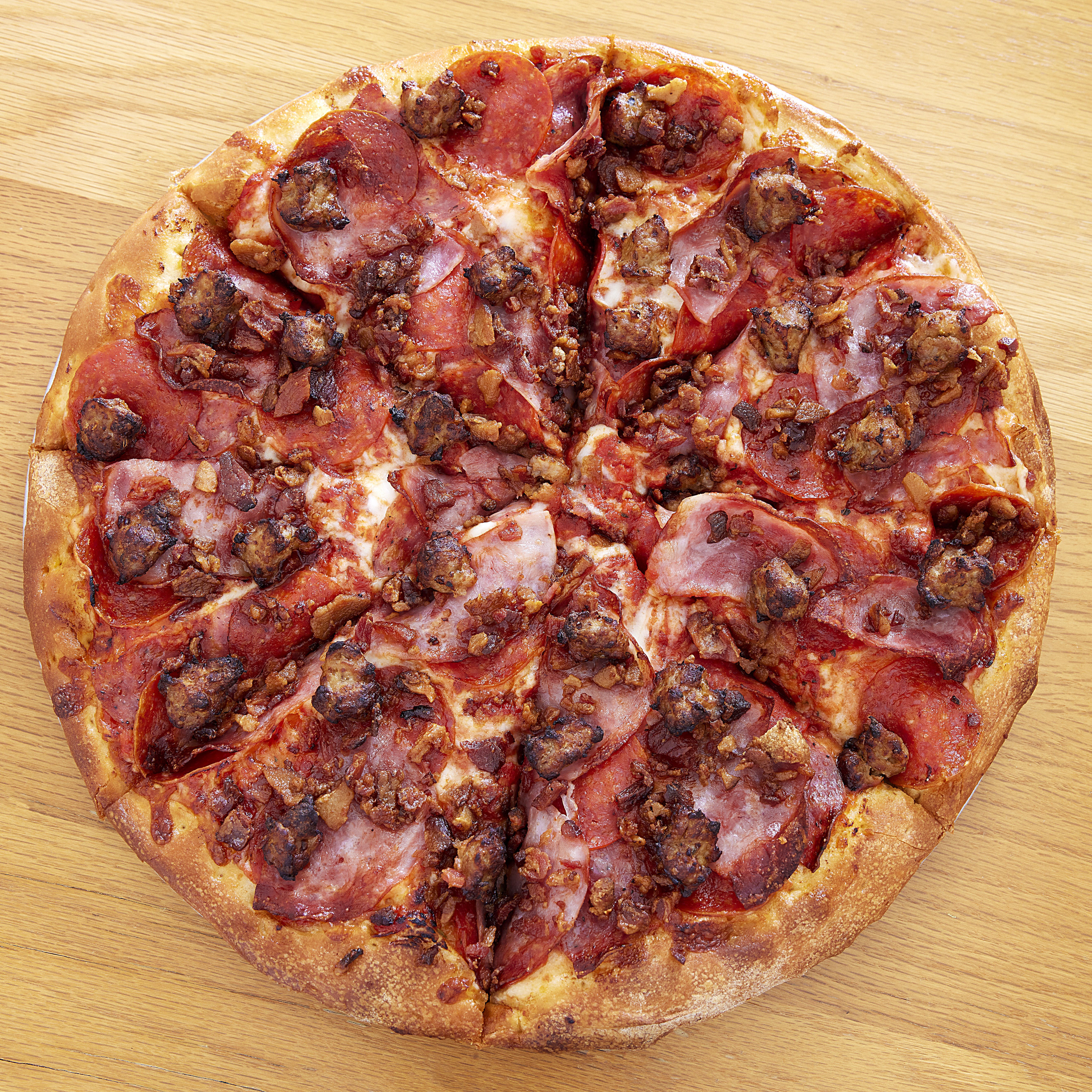 Order Meat Lovers Pizza - Medium 12" (8 Slices) food online from Famous Pizza store, Sacramento on bringmethat.com