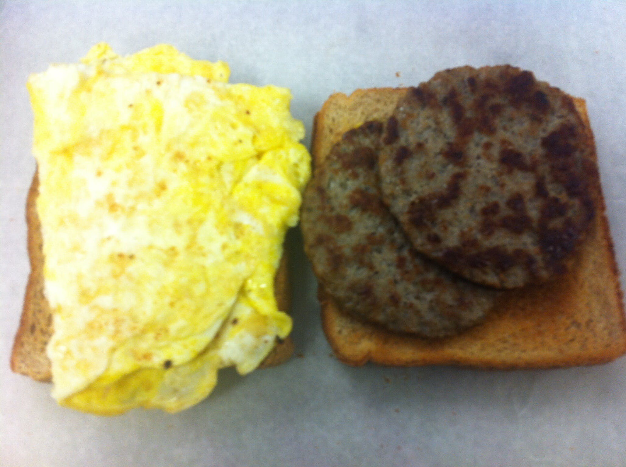 Order Sausage Sandwich with Egg Breakfast - Small food online from New Tiny Hoagie Shop store, Media on bringmethat.com