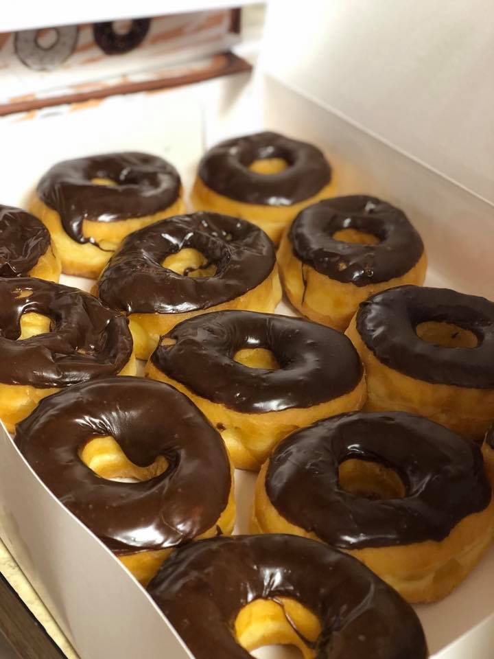 Order One Dozen Chocolate Iced Donuts +2 EXTRA FREE  food online from Ashley Donuts store, Houston on bringmethat.com