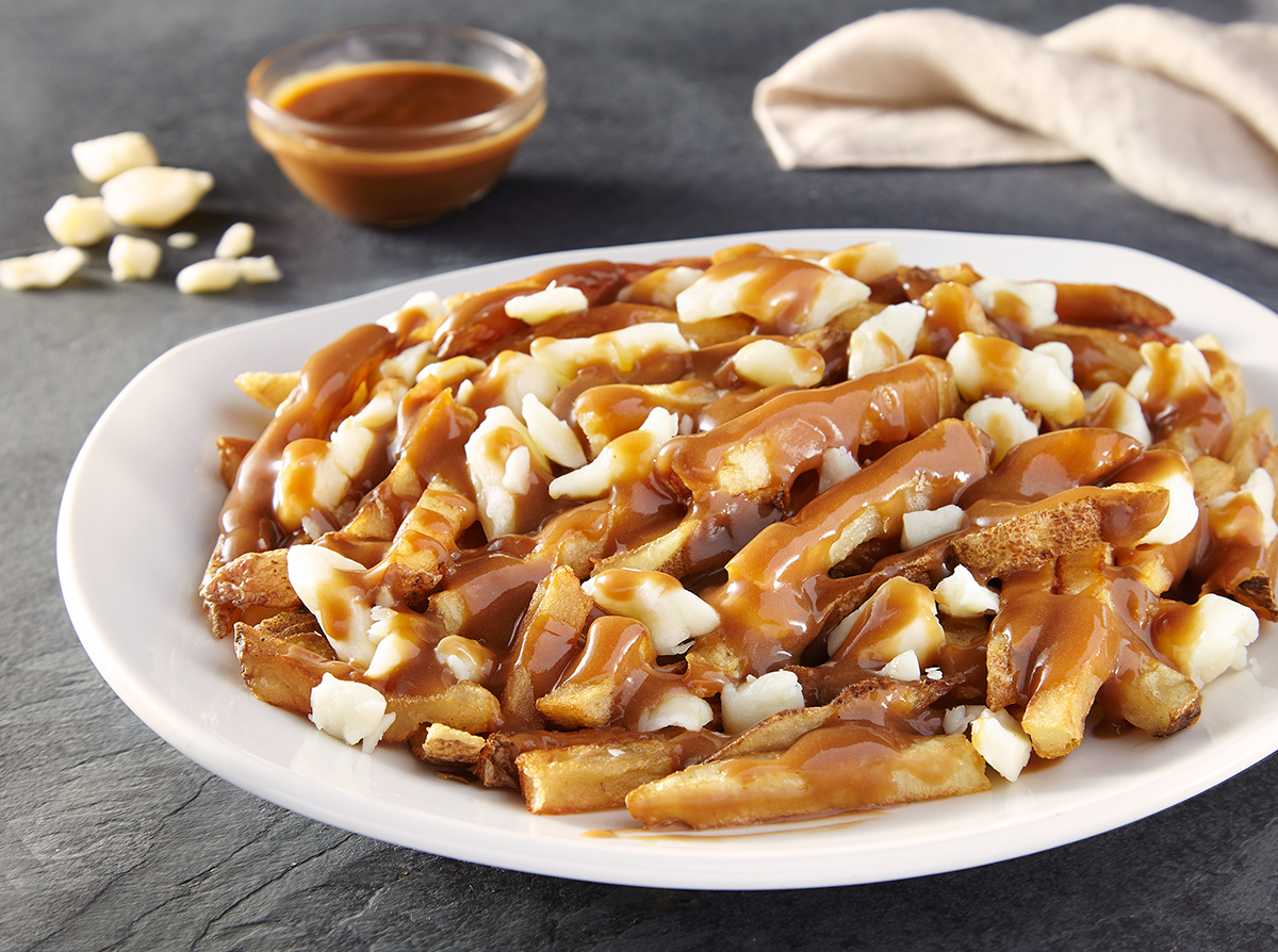 Order Classic Canadian Poutine Loaded Spud food online from French Fry Heaven store, Newark on bringmethat.com