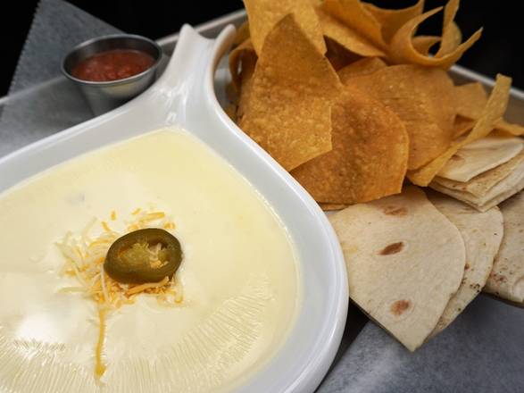 Order *Queso Dip* food online from Sidelines Grille store, canton on bringmethat.com