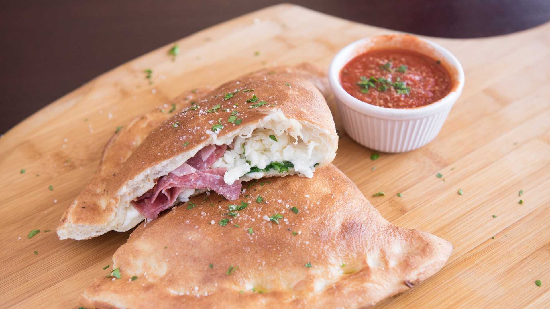 Order Capone Calzone food online from Soprano's Pizza & Pasta store, Seattle on bringmethat.com