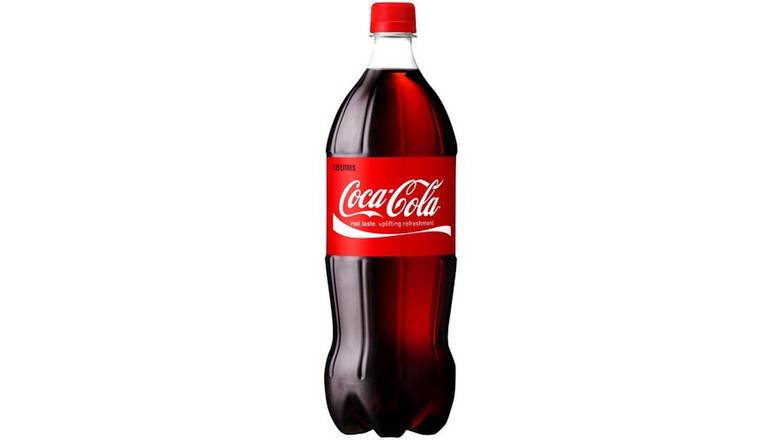 Order Coca-Cola Soda 1.25 litre food online from Route 7 Food Mart store, Norwalk on bringmethat.com