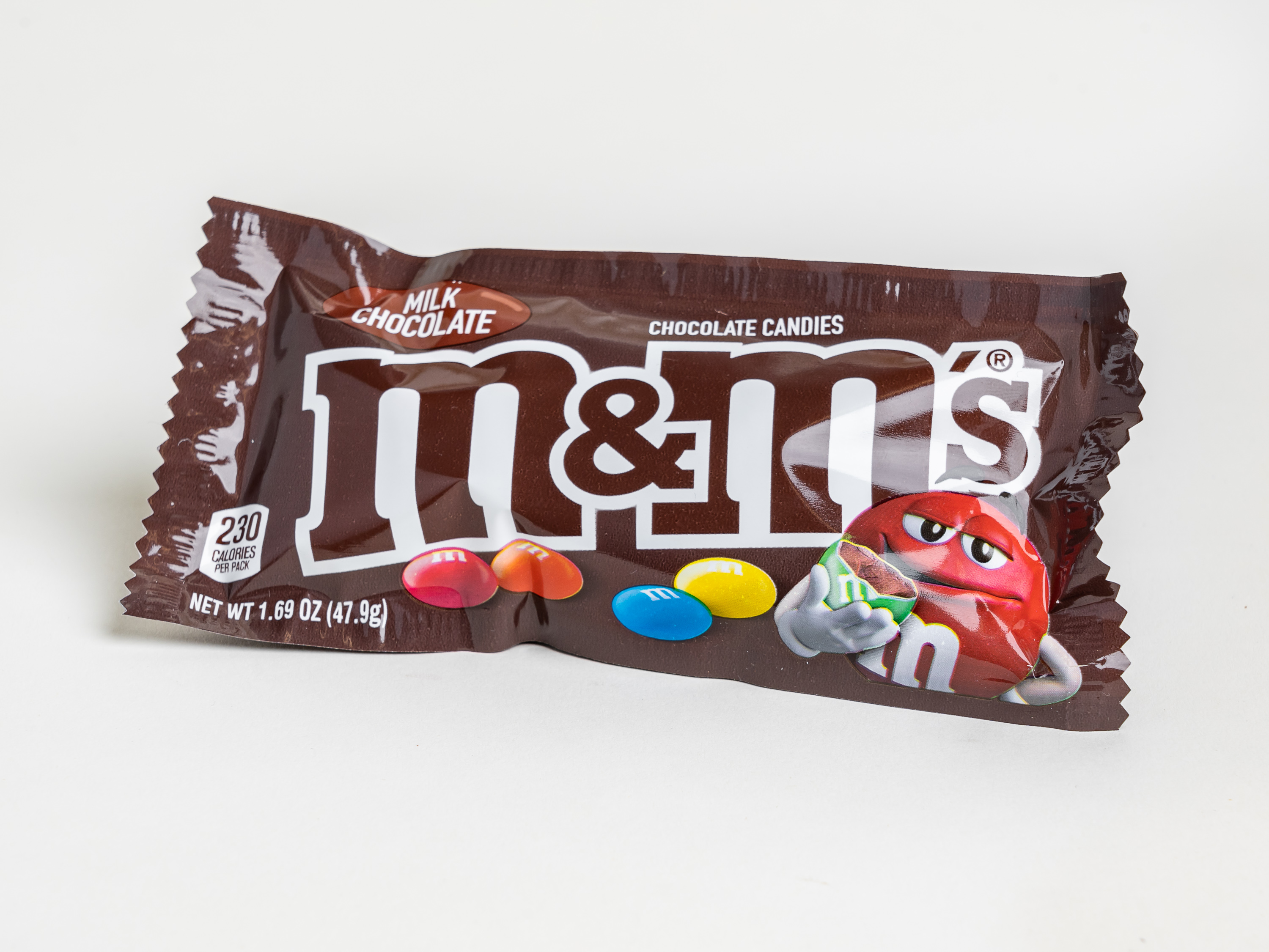 Order M&M's Milk Chocolate Candy, 1.69 oz. food online from Kangaroo Food Mart store, Cathedral City on bringmethat.com