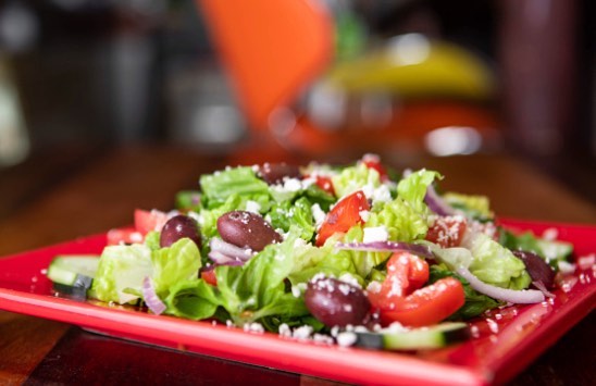 Order Greek Salad food online from Gianni's Pizza store, Oceanside on bringmethat.com