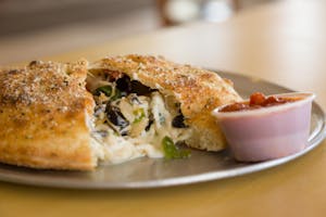 Order Meat Calzone food online from Massino's Pizzeria store, Aurora on bringmethat.com