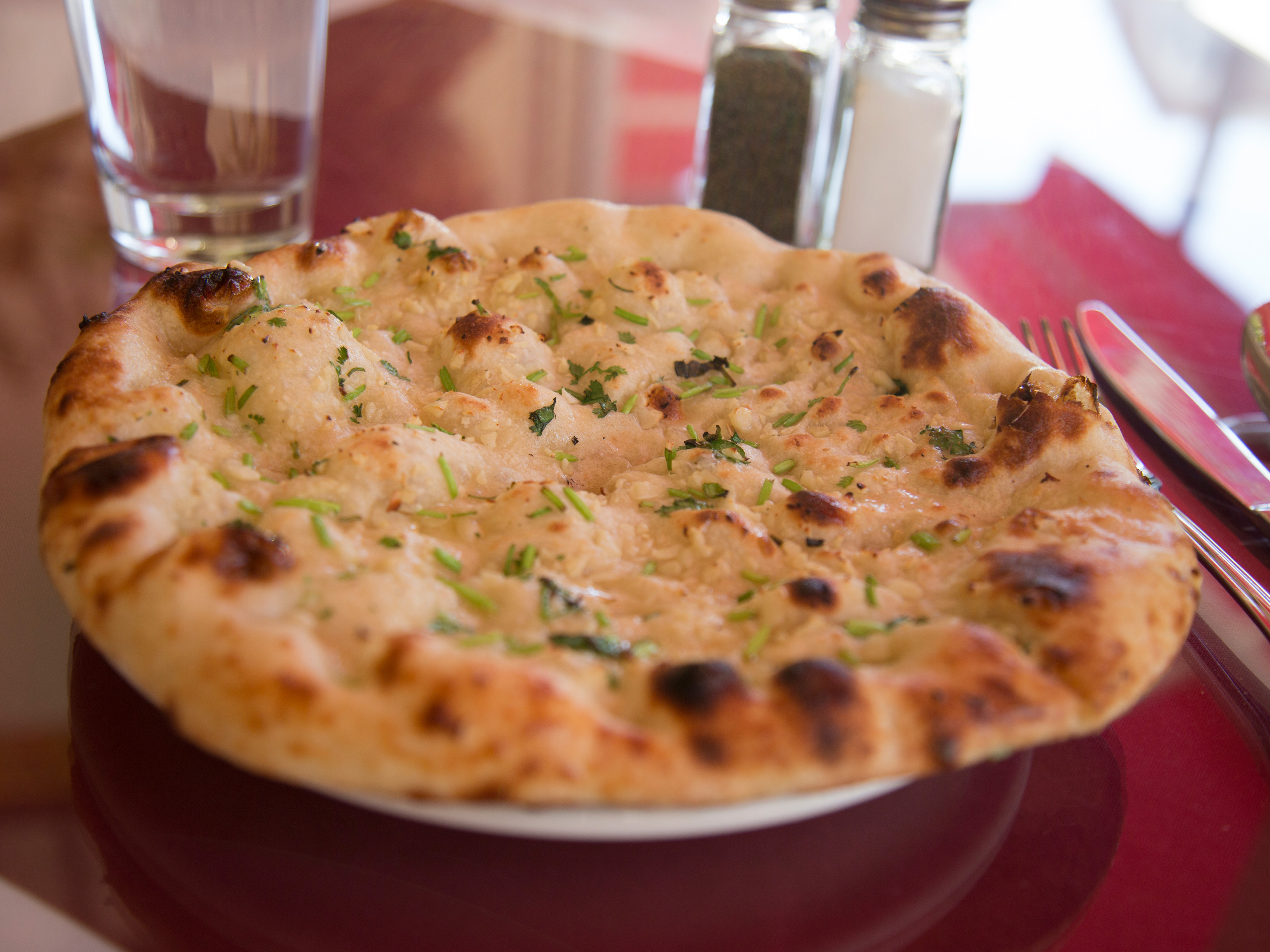 Order Garlic Naan food online from Himalayan Spice store, Oakland on bringmethat.com