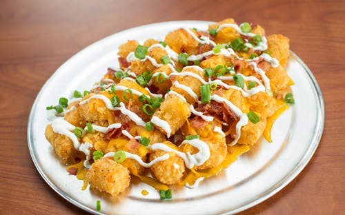 Order Loaded Tots - Appetizer food online from Native Grill & Wings store, Phoenix on bringmethat.com