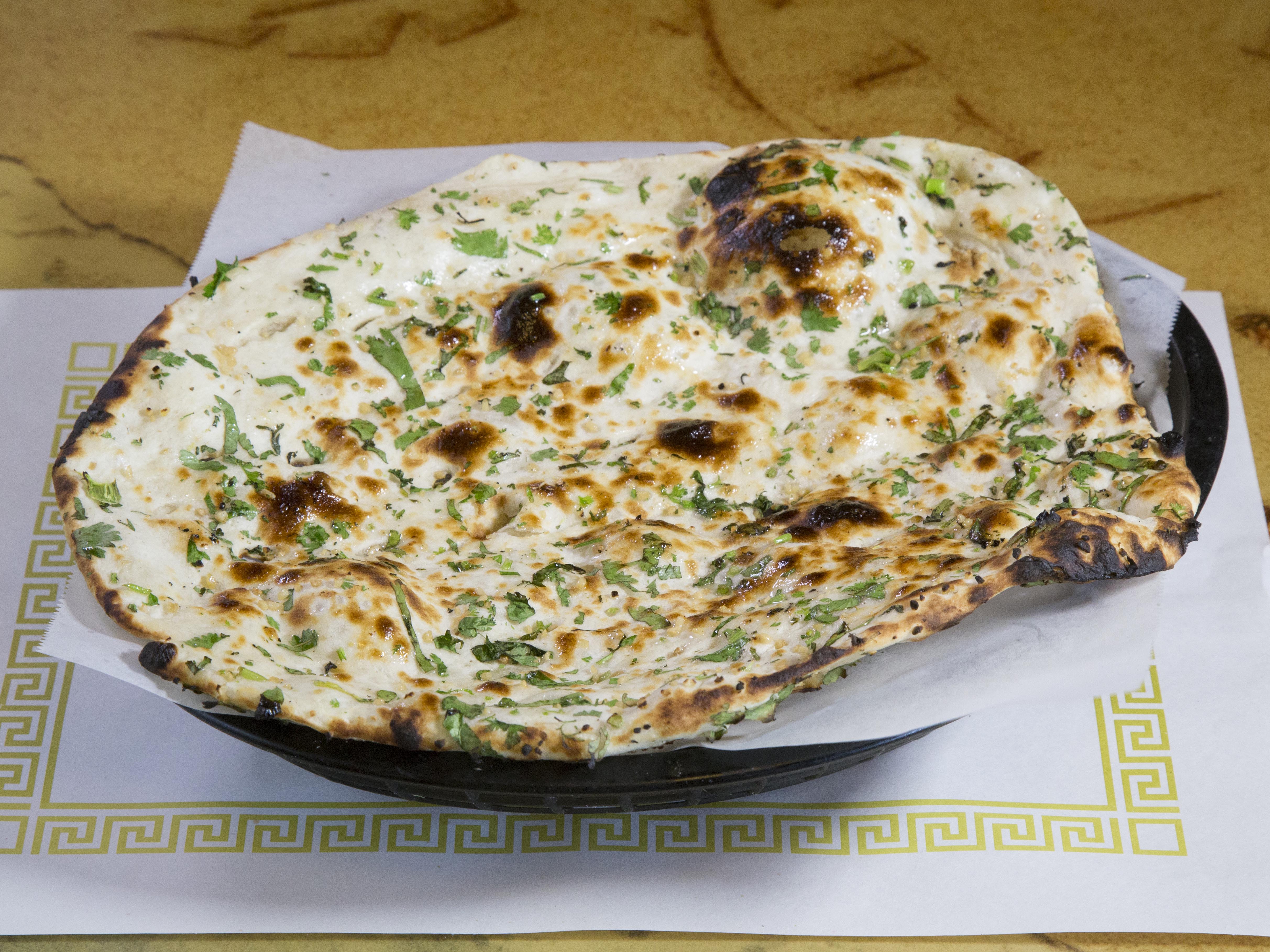 Order 66. Garlic Naan food online from India Oven store, Mesa on bringmethat.com