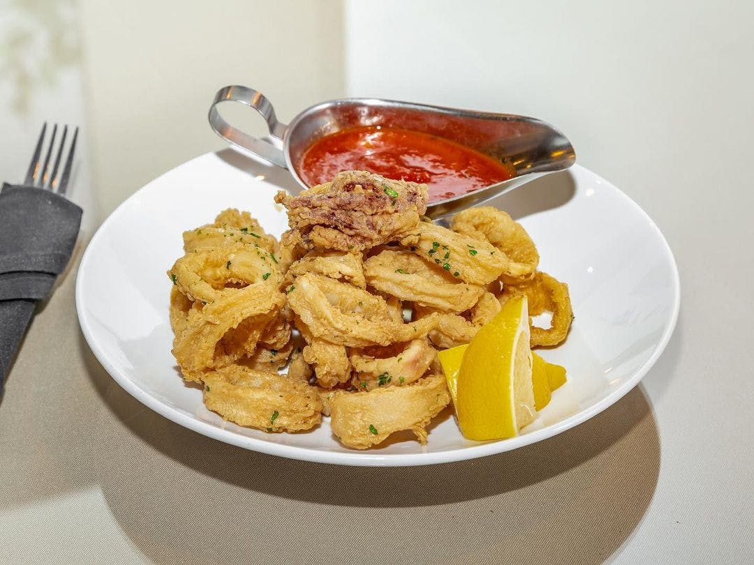 Order Fried Calamari - Appetizer food online from Dolce Pizzeria & Restaurant store, Fords on bringmethat.com