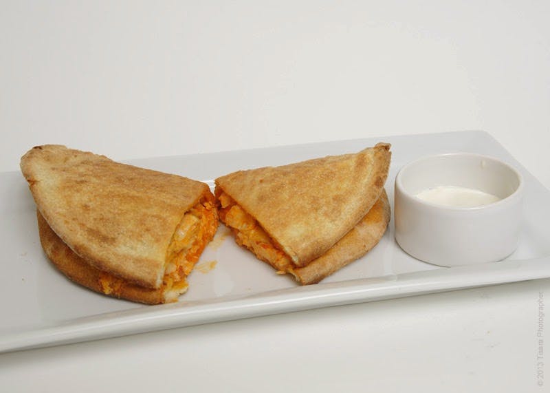 Order Buffalo Chicken Calzone - Calzone food online from Monterey's Pizza store, Alexandria on bringmethat.com