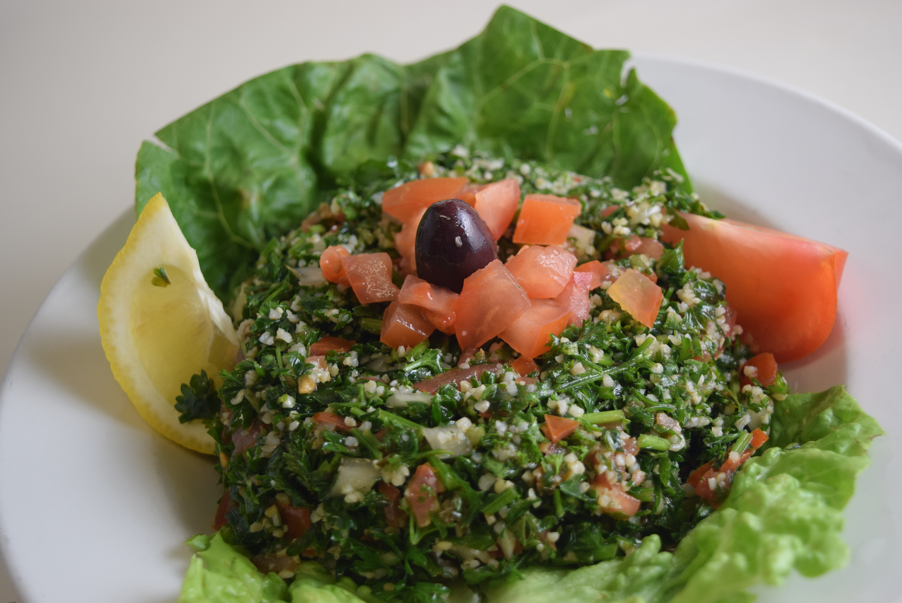 Order Tabouleh Salad food online from Cafe Athena store, San Diego on bringmethat.com