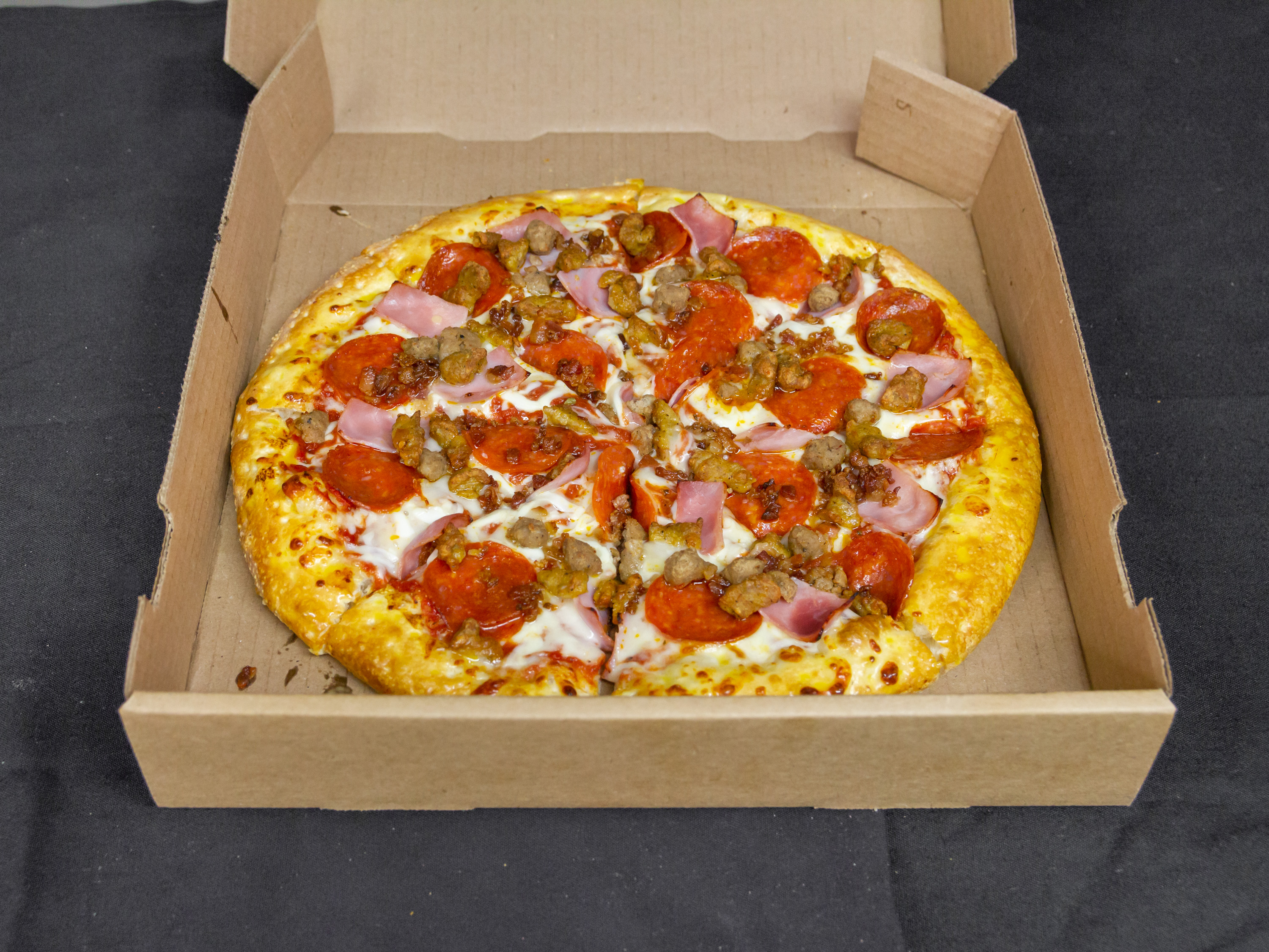Order Meat Lovers Pizza food online from Fire Pizza store, Detroit on bringmethat.com