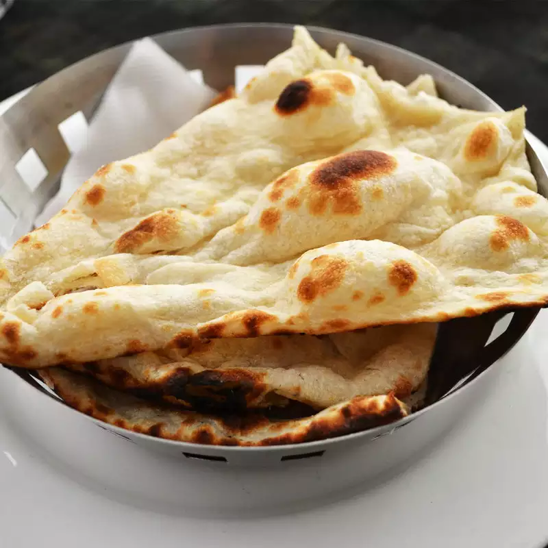 Order Naan food online from King of Tandoor Fine Indian Restaurant store, Philadelphia on bringmethat.com