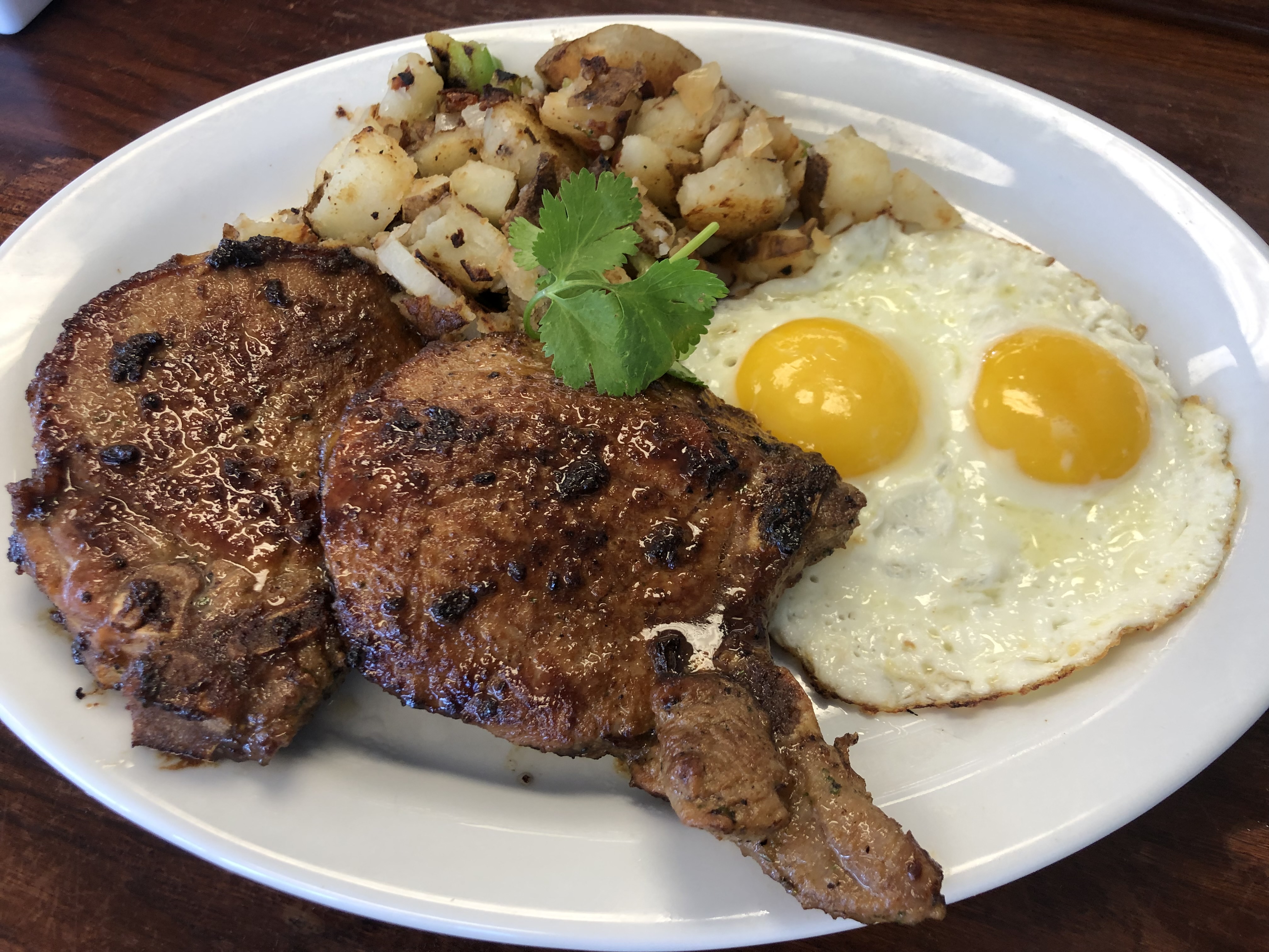 Order Marinated Pork Chops and Eggs with Waffle Breakfast food online from Hungry Fox store, North Hollywood on bringmethat.com
